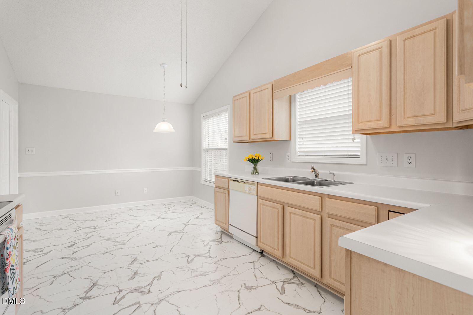 605 Huntingdon Street Elon, NC 27244 - Photo 5 of 18 a kitchen with a sink cabinets and window