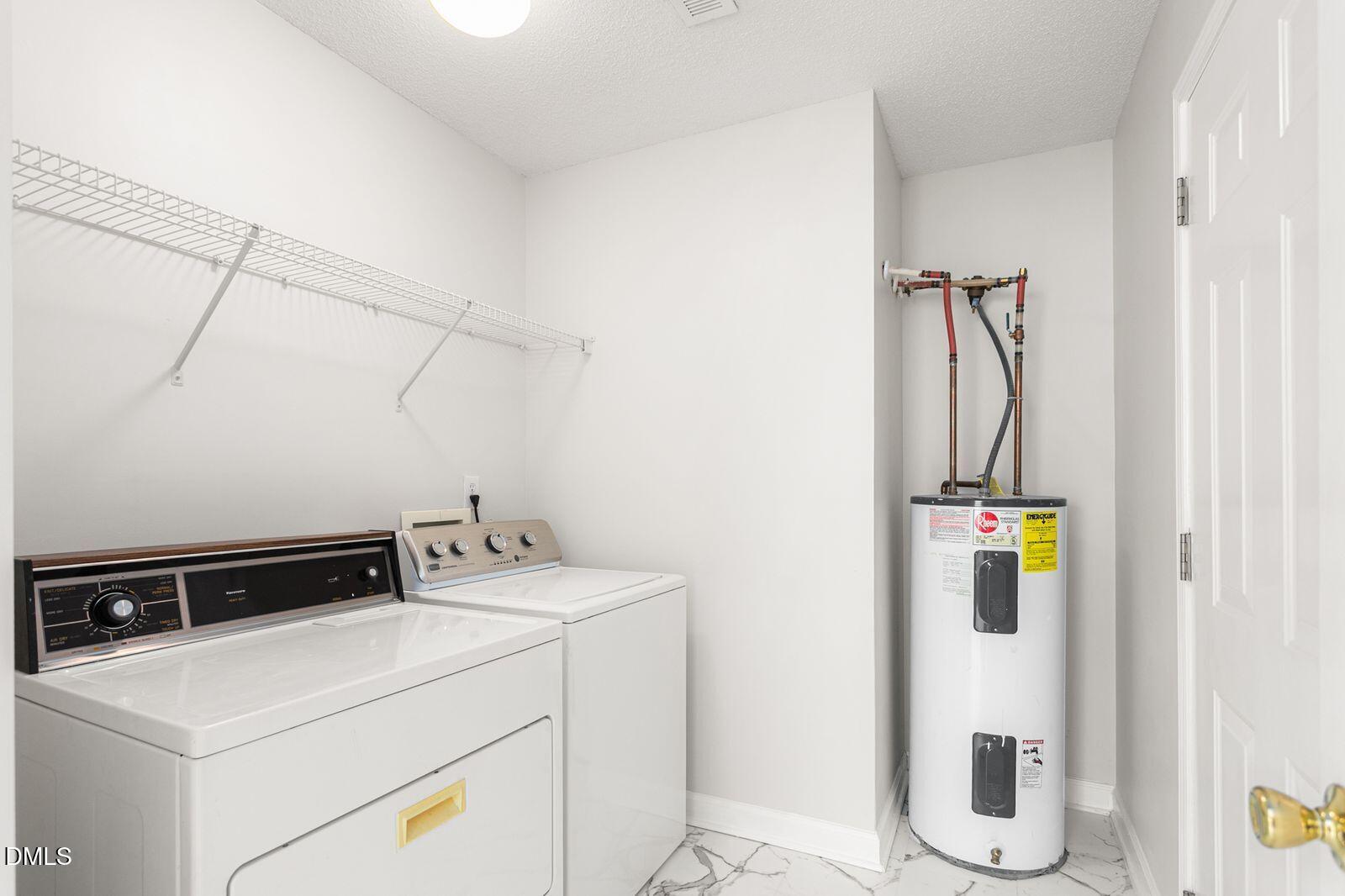 605 Huntingdon Street Elon, NC 27244 - Photo 6 of 18 a utility room with dryer and washer
