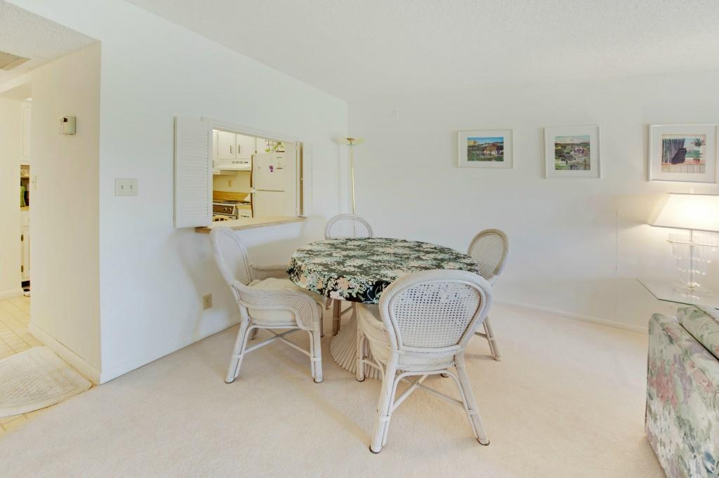 9440 Southwest 8th Street, Unit 220 Boca Raton, FL 33428 - Photo 7 of 9 a view of a dining room with furniture and window