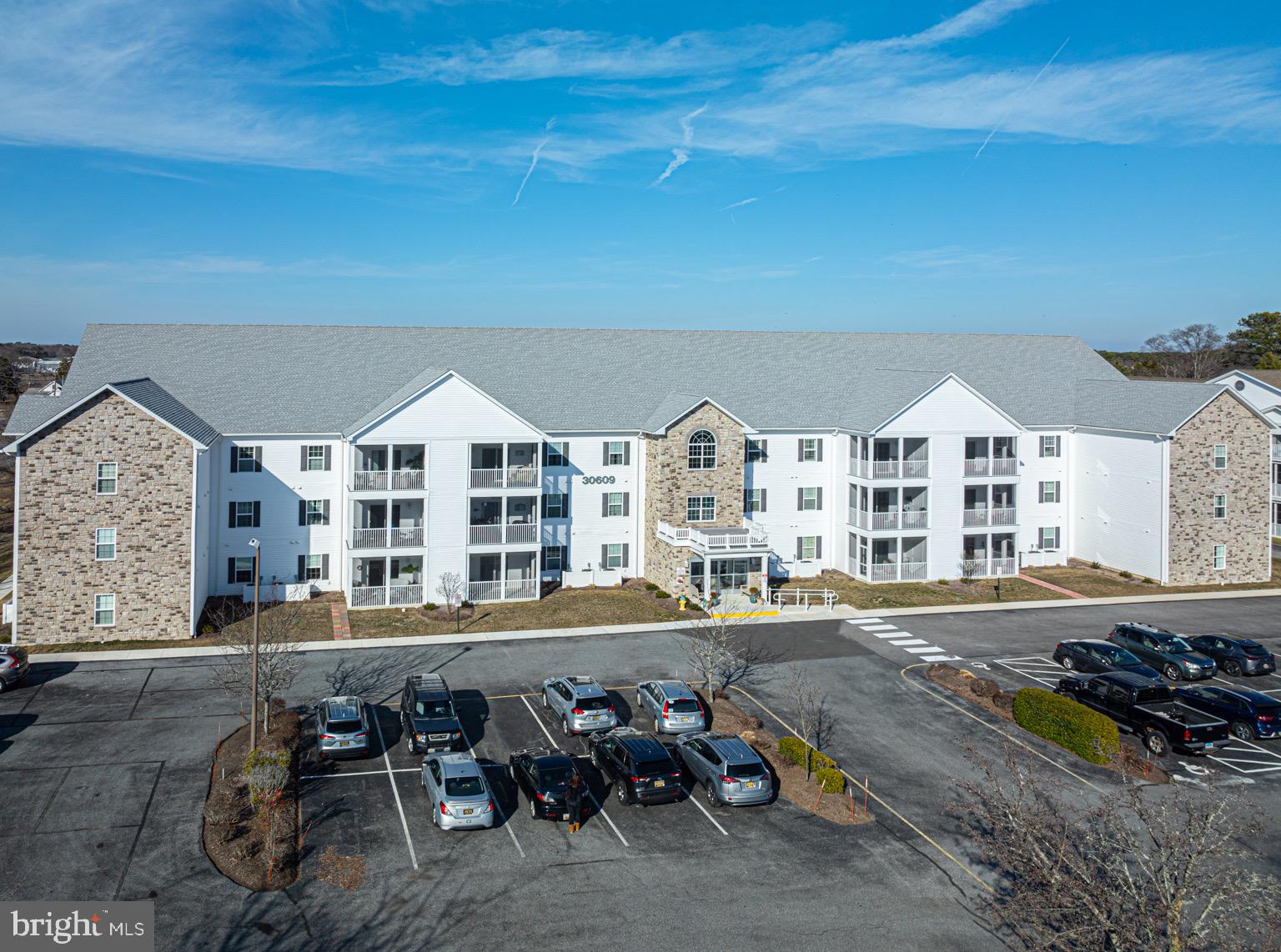 30609 Cedar Neck Road, Unit 3103 Ocean View, DE 19970 - Photo 1 of 39 a view of yard with outdoor seating