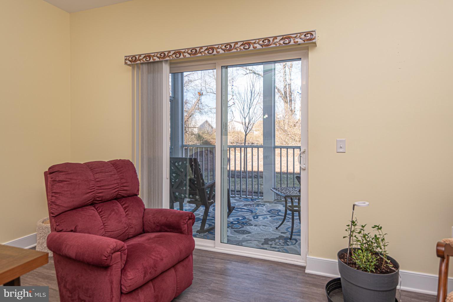 30609 Cedar Neck Road, Unit 3103 Ocean View, DE 19970 - Photo 26 of 39 a room with furniture and a potted plant