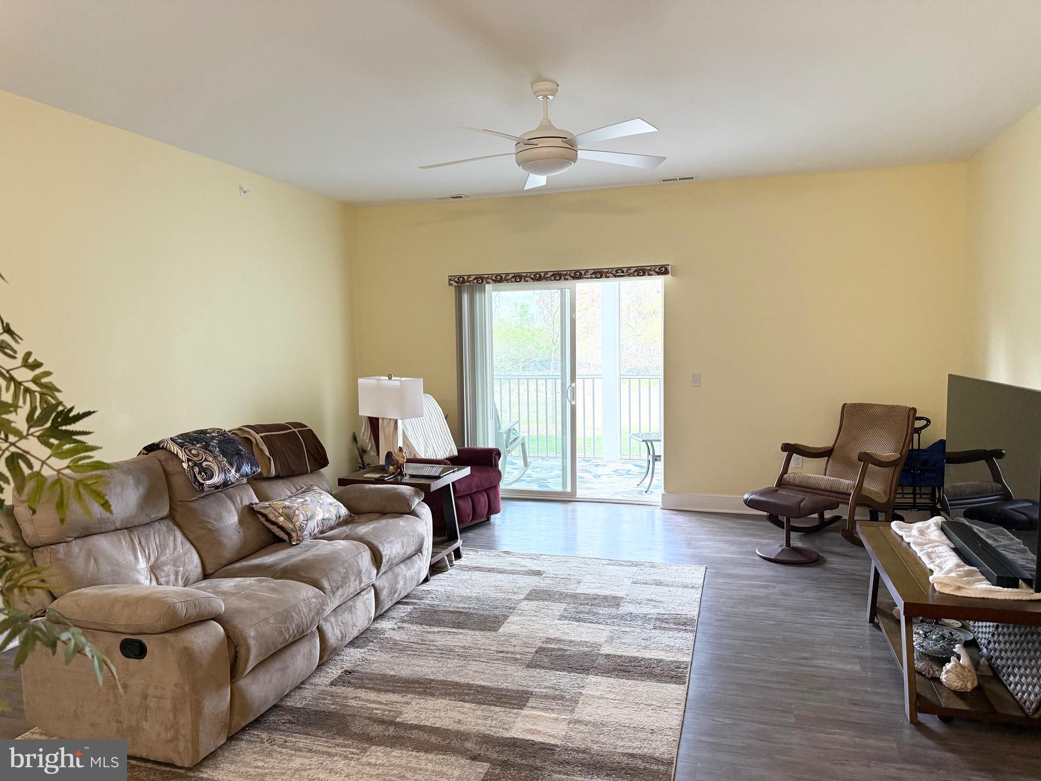 30609 Cedar Neck Road, Unit 3103 Ocean View, DE 19970 - Photo 3 of 39 a living room with furniture and a window