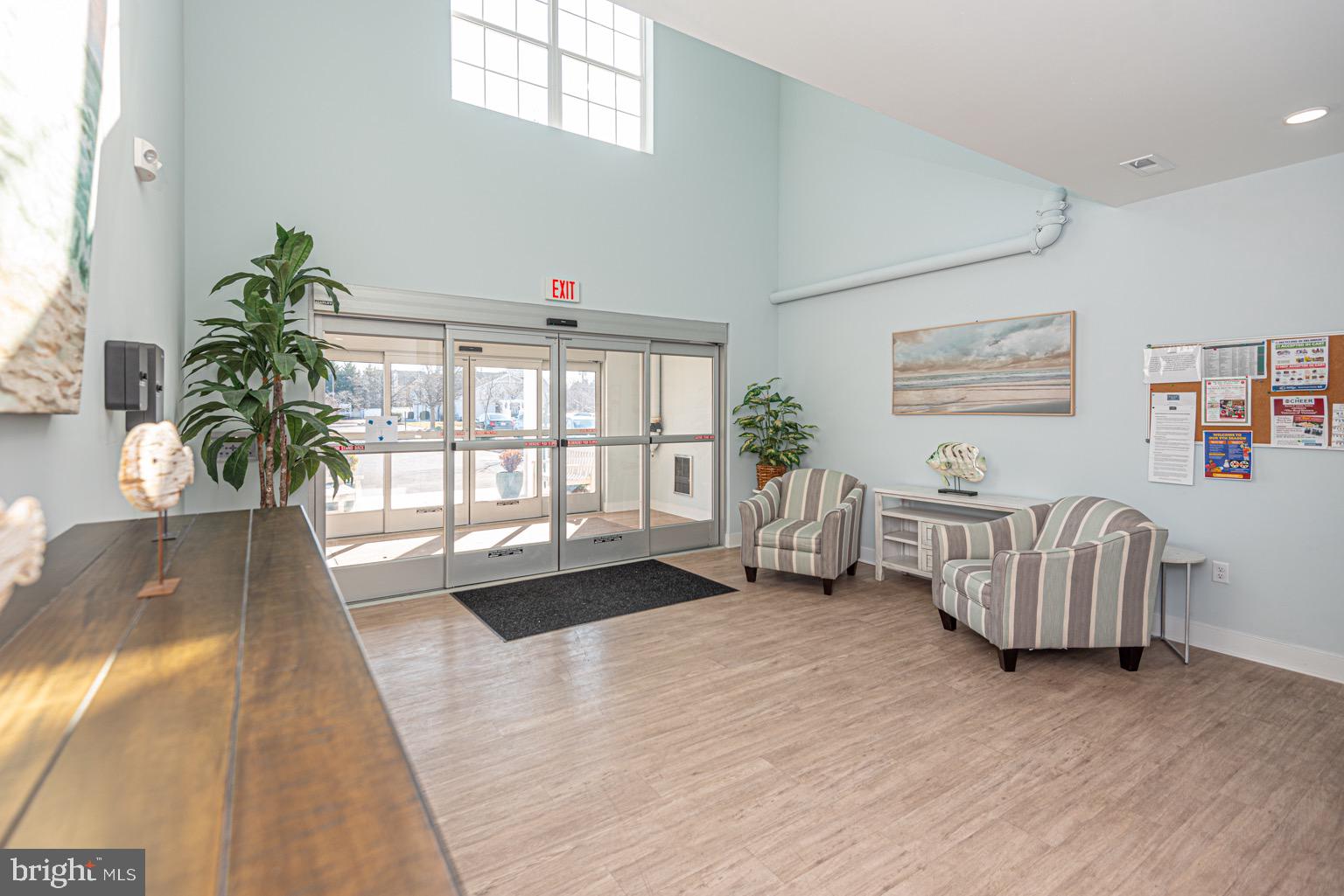 30609 Cedar Neck Road, Unit 3103 Ocean View, DE 19970 - Photo 31 of 39 a living room with furniture and a large window