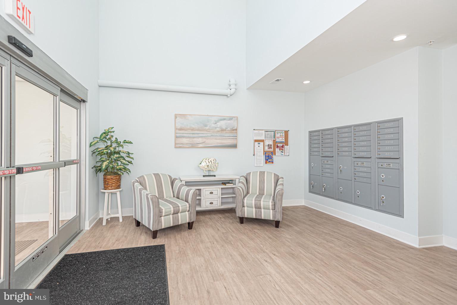 30609 Cedar Neck Road, Unit 3103 Ocean View, DE 19970 - Photo 32 of 39 a living room with furniture and a gate
