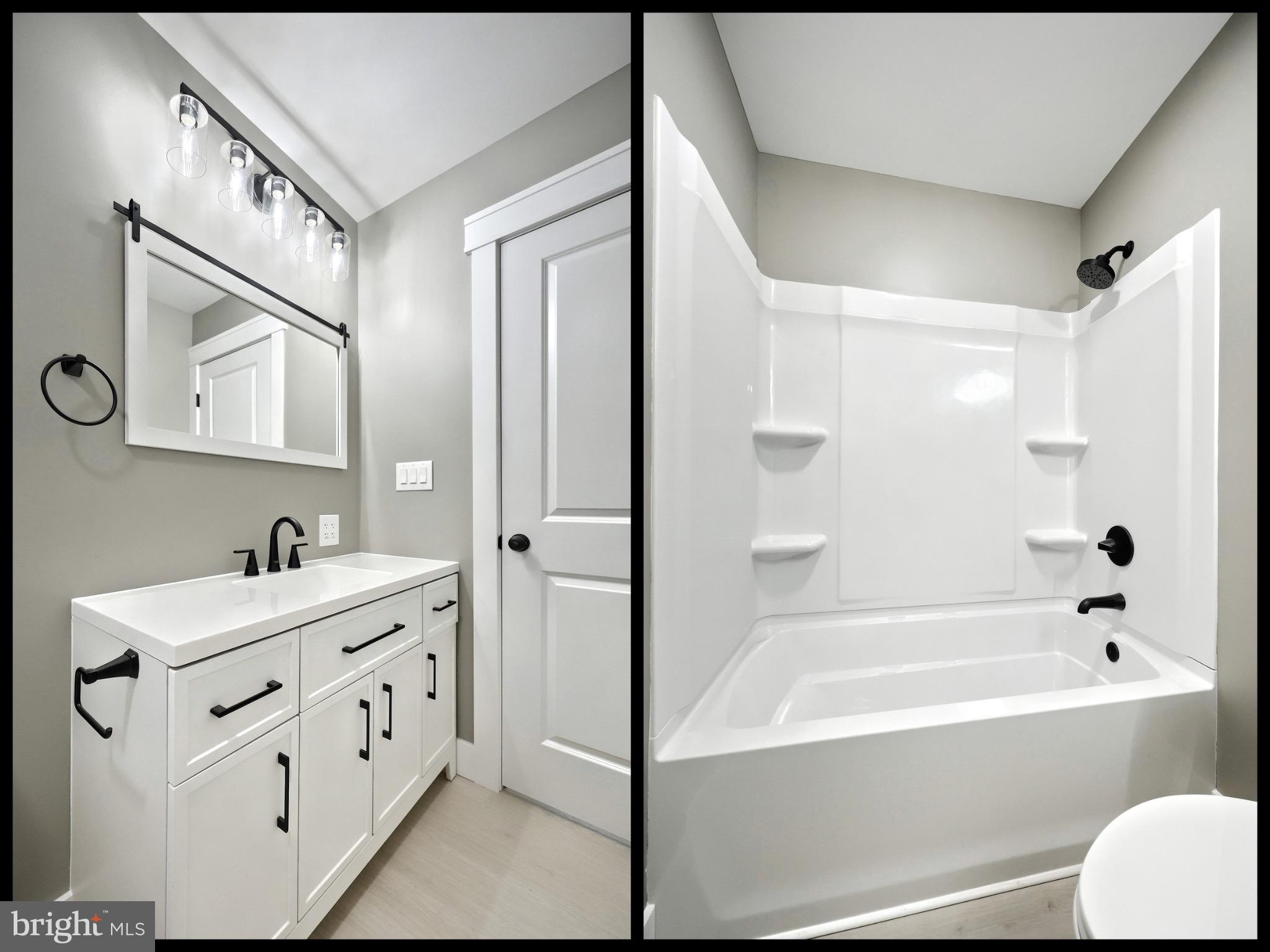 10 Echo Trail Fairfield, PA 17320 - Photo 12 of 43 a bathroom with a bathtub sink vanity and mirror