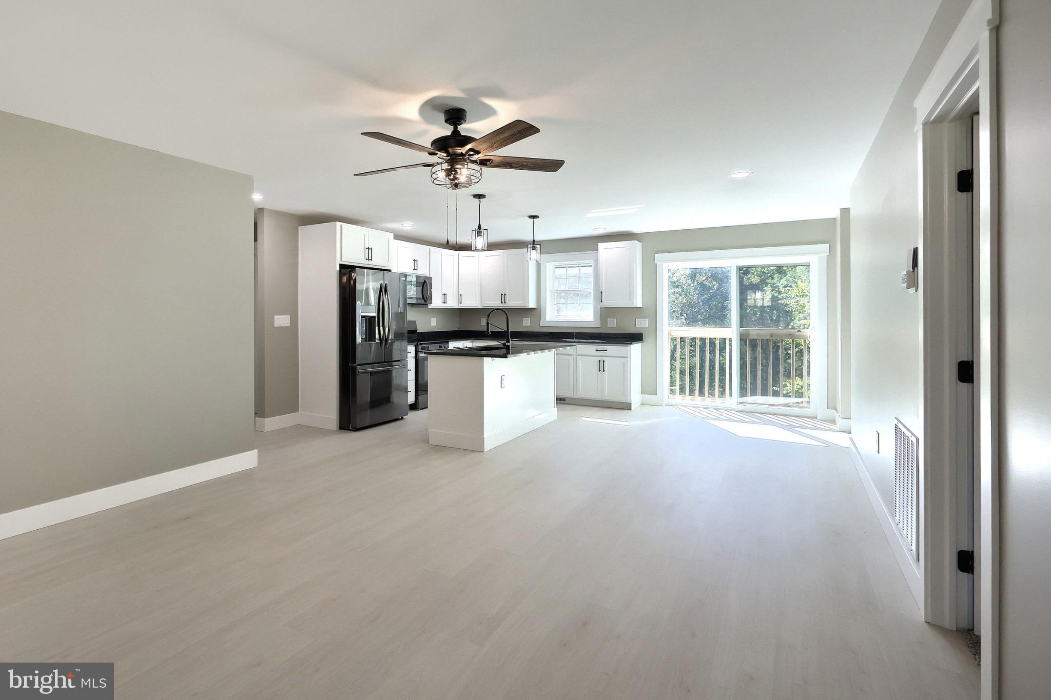 10 Echo Trail Fairfield, PA 17320 - Photo 19 of 43 a view of a kitchen with a sink a ceiling fan and stainless steel appliances