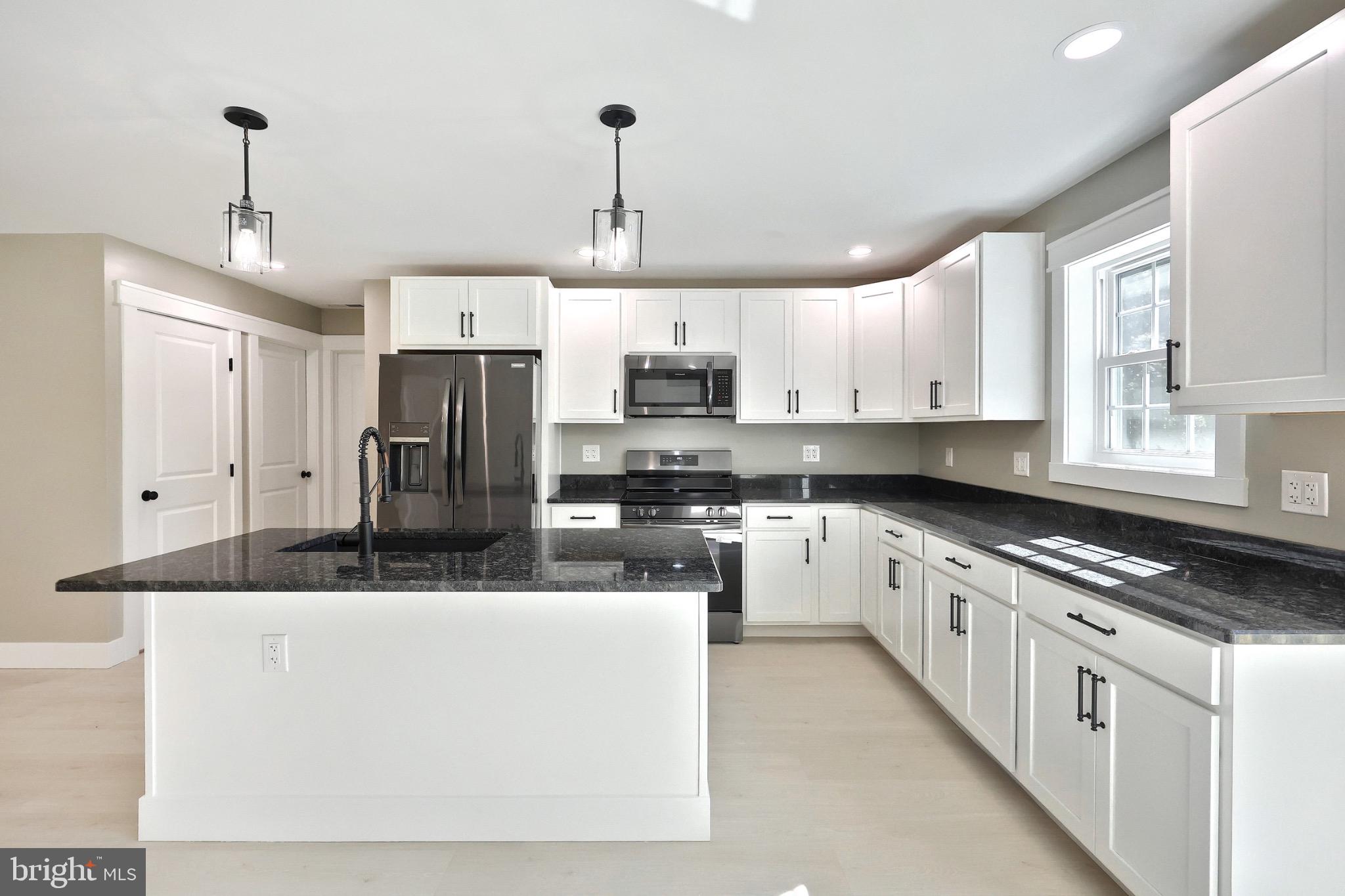 10 Echo Trail Fairfield, PA 17320 - Photo 22 of 43 a kitchen with stainless steel appliances granite countertop a sink a stove a refrigerator a center island and cabinets