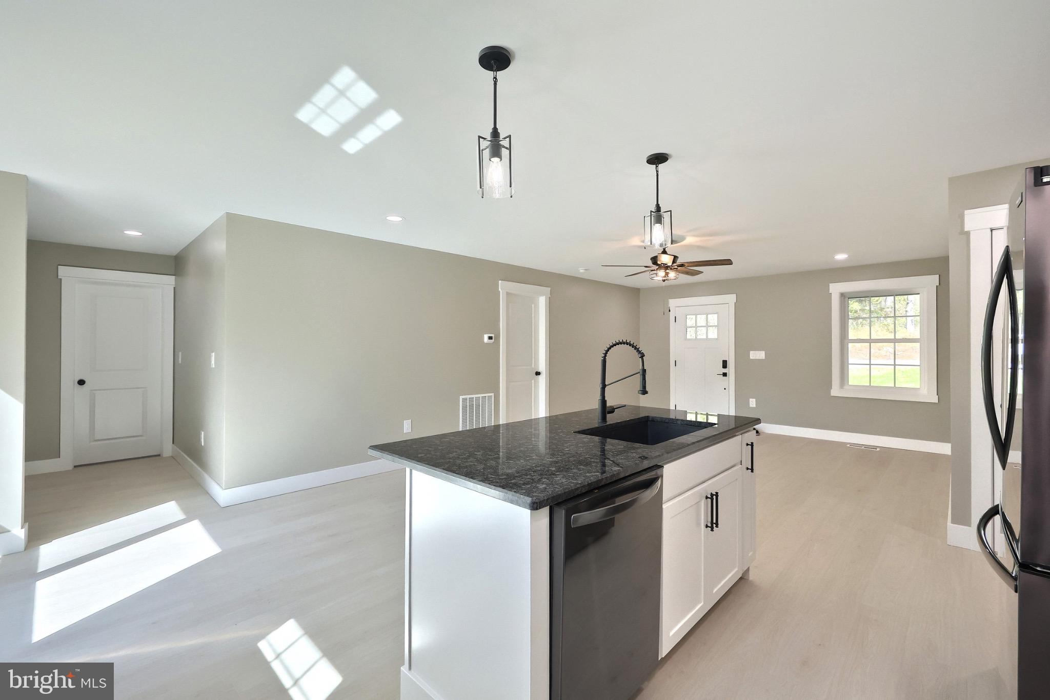 10 Echo Trail Fairfield, PA 17320 - Photo 24 of 43 a kitchen with granite countertop a sink cabinets and chandelier