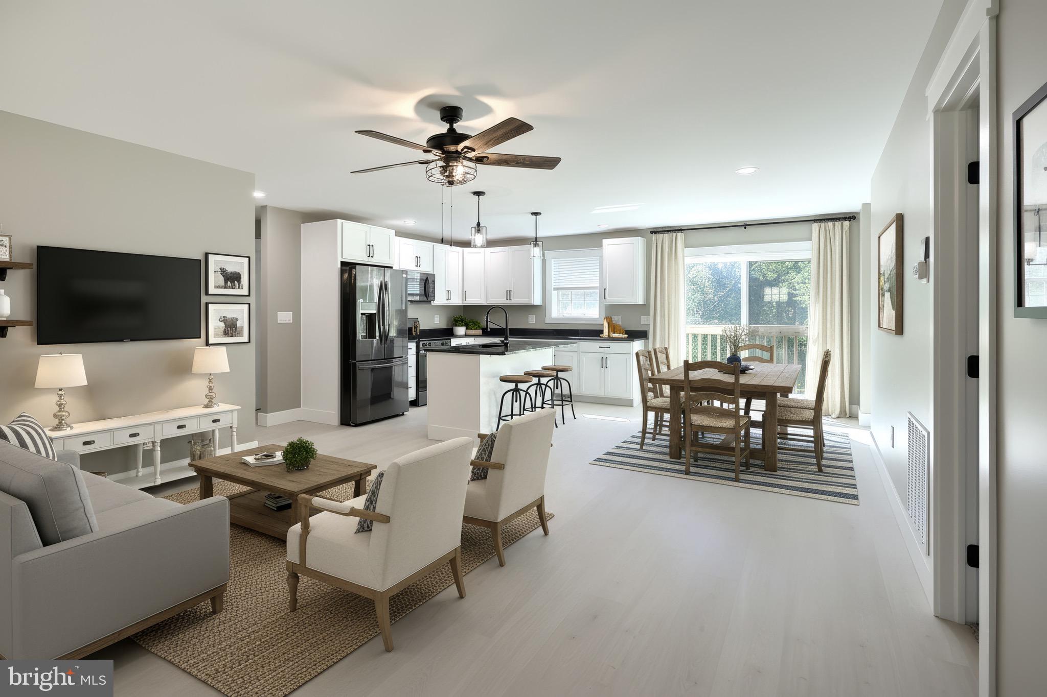 10 Echo Trail Fairfield, PA 17320 - Photo 4 of 43 a living room with furniture and a flat screen tv with kitchen view