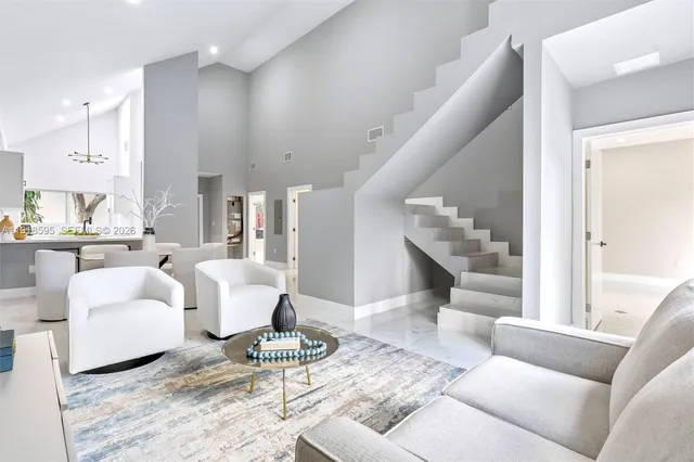 a living room with furniture and a table