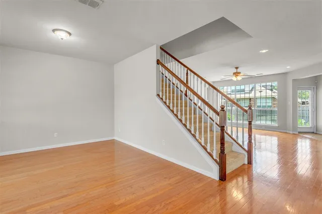 a view of an entryway with wooden floor