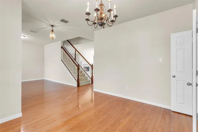 a view of an entryway with wooden floor
