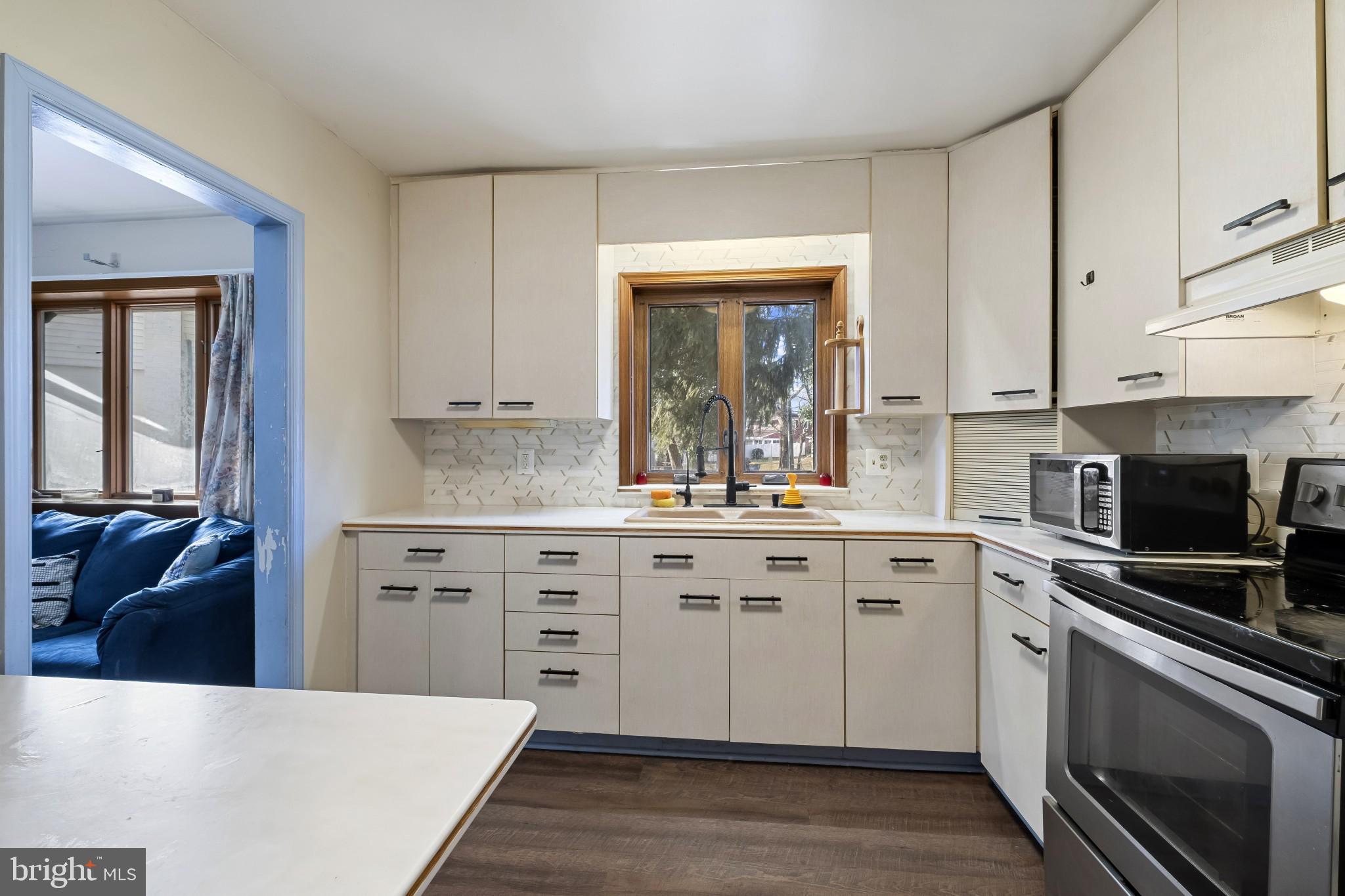804 Sunset Terrace Dover, DE 19904 - Photo 13 of 33 a kitchen with granite countertop white cabinets and white appliances