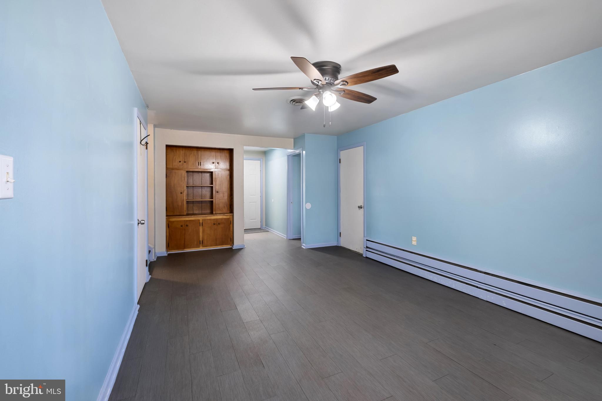 804 Sunset Terrace Dover, DE 19904 - Photo 14 of 33 an empty room with chandelier fan and windows
