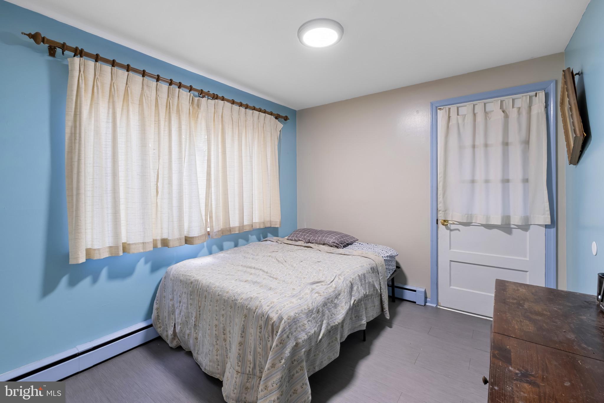 804 Sunset Terrace Dover, DE 19904 - Photo 17 of 33 a bedroom with a bed and a window