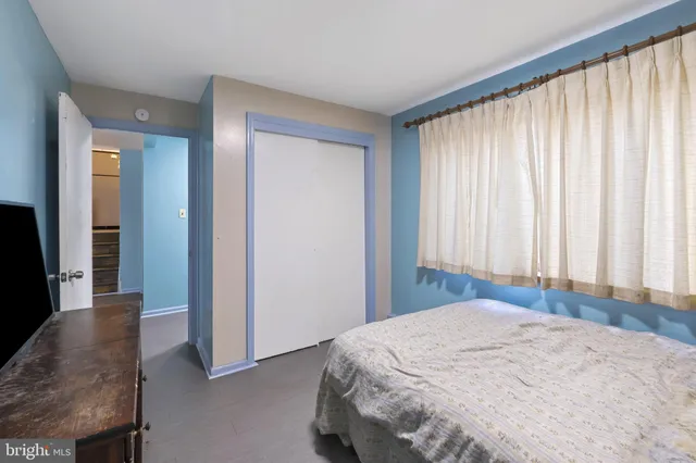 a bathroom with a granite countertop sink a mirror and a shower