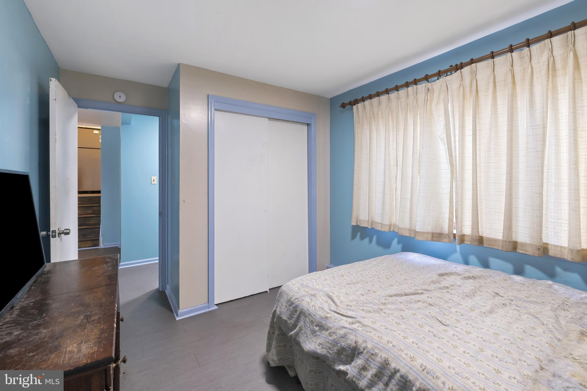 804 Sunset Terrace Dover, DE 19904 - Photo 18 of 33 a bedroom with a bed and a large mirror