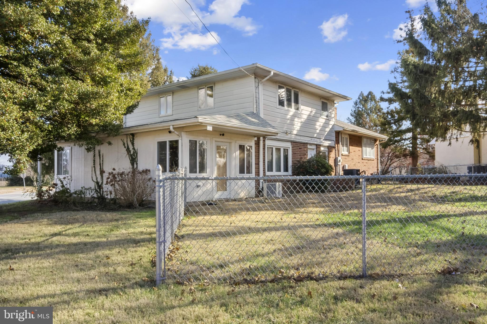 804 Sunset Terrace Dover, DE 19904 - Photo 2 of 33 a view of a white house next to a yard with palm trees