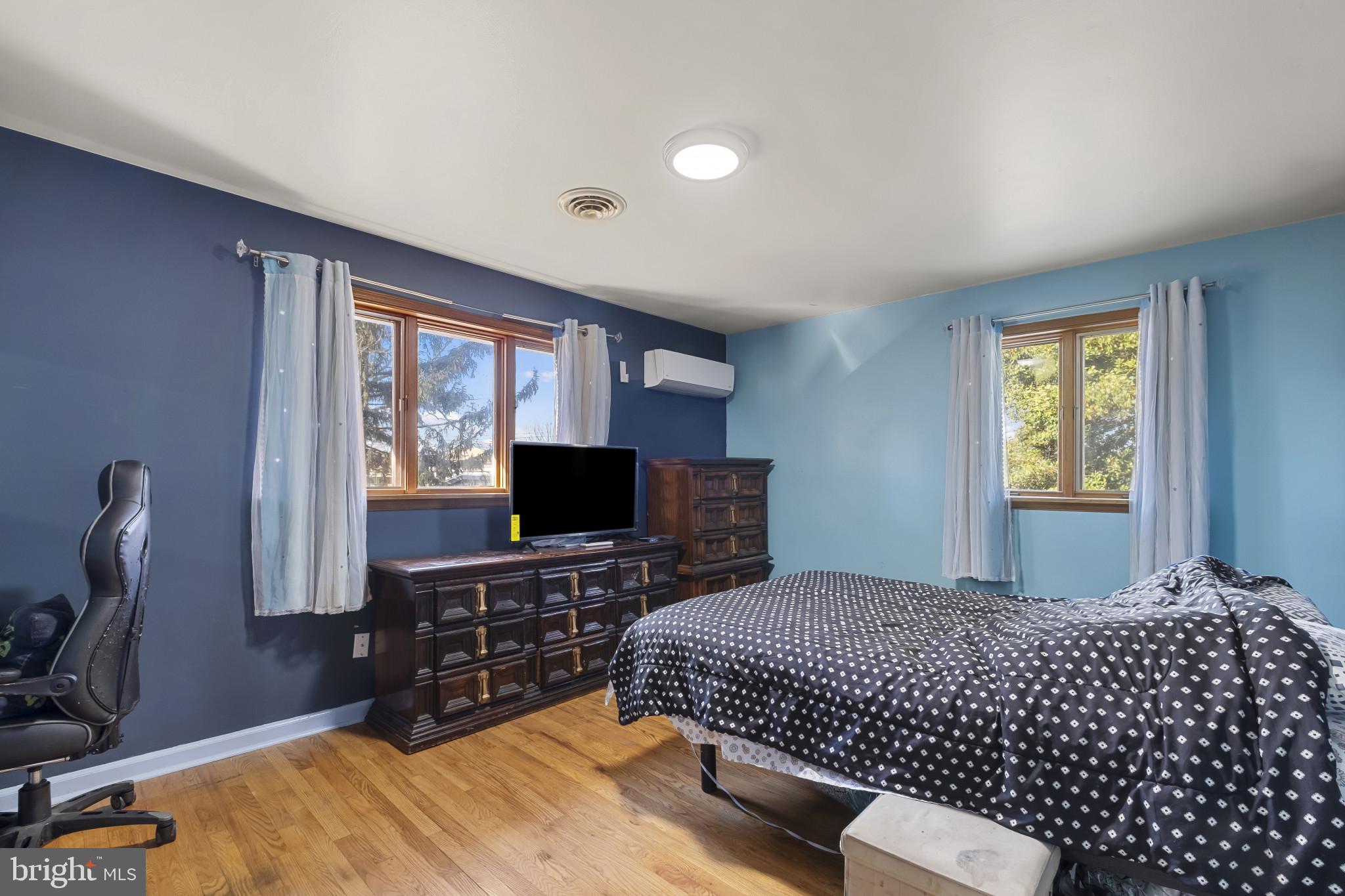 804 Sunset Terrace Dover, DE 19904 - Photo 22 of 33 a bedroom with a bed and a flat screen tv