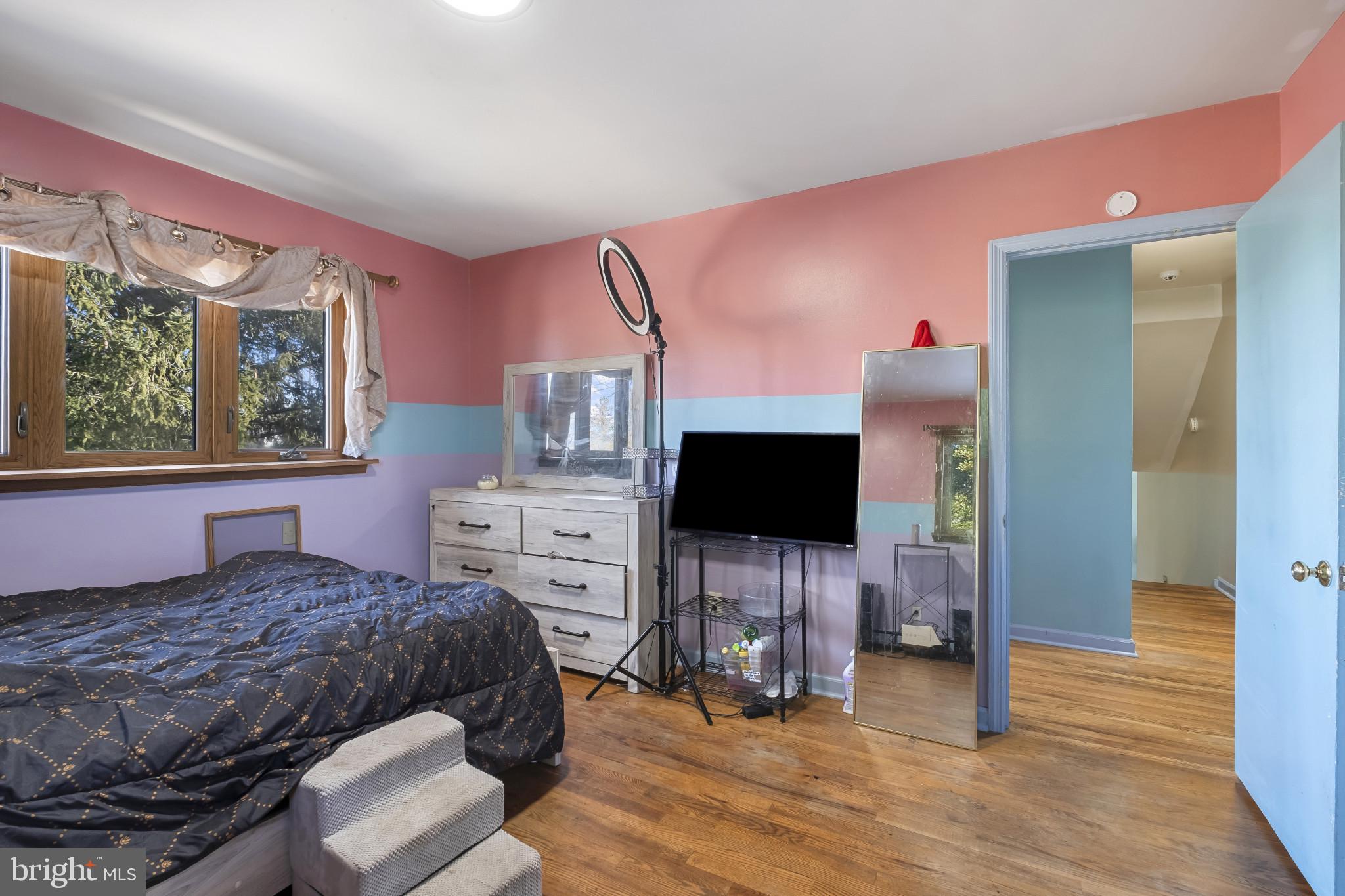 804 Sunset Terrace Dover, DE 19904 - Photo 27 of 33 a bedroom with a bed and a flat screen tv