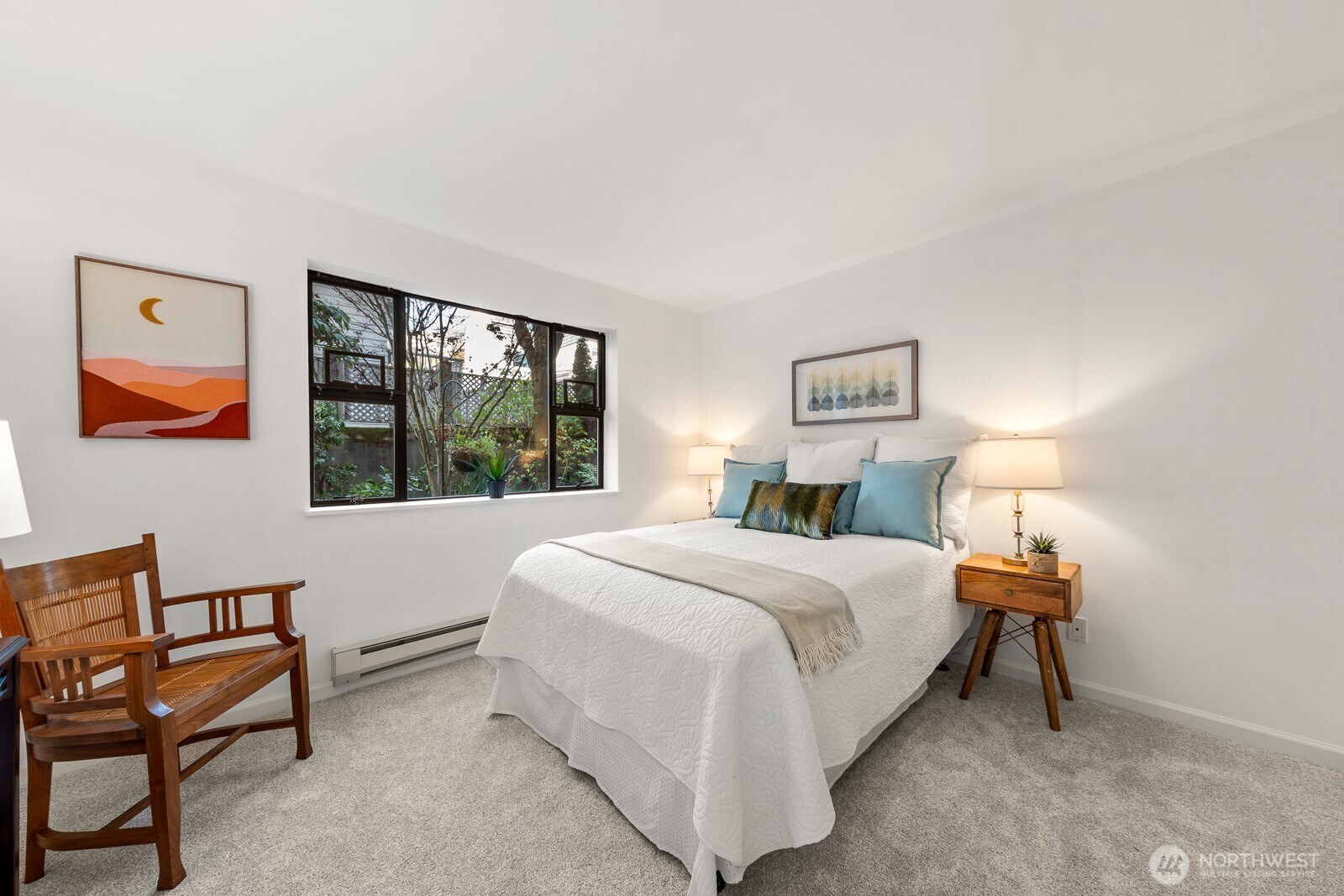 912 3rd Avenue West, Unit 101 Seattle, WA 98119 - Photo 14 of 25 a bedroom with a bed and a window