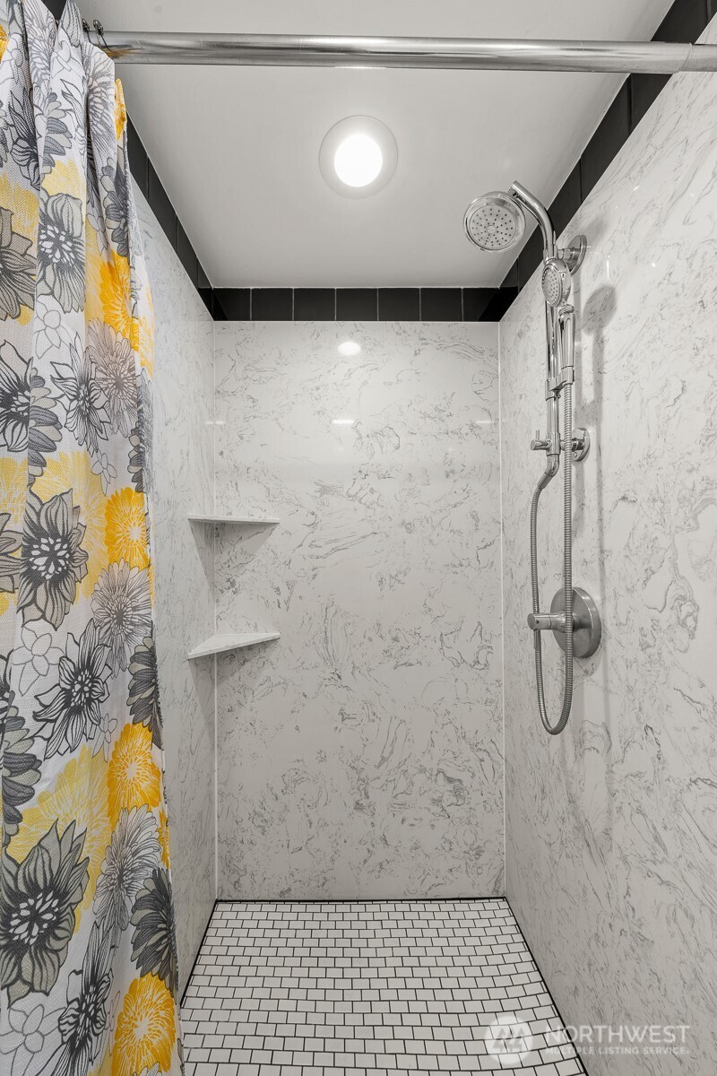 912 3rd Avenue West, Unit 101 Seattle, WA 98119 - Photo 20 of 25 a bathroom with a shower