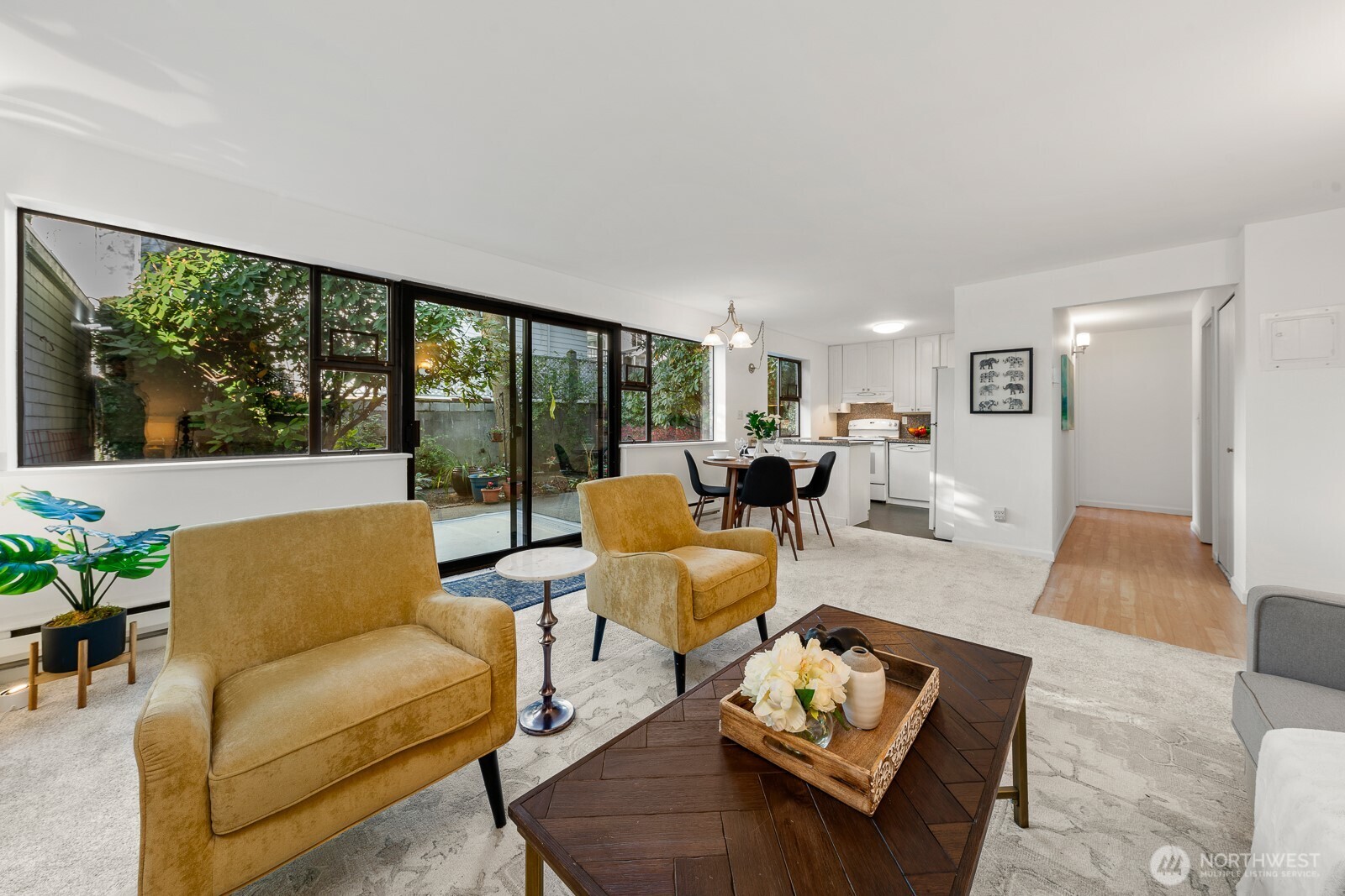 912 3rd Avenue West, Unit 101 Seattle, WA 98119 - Photo 3 of 25 a living room with furniture and a large window