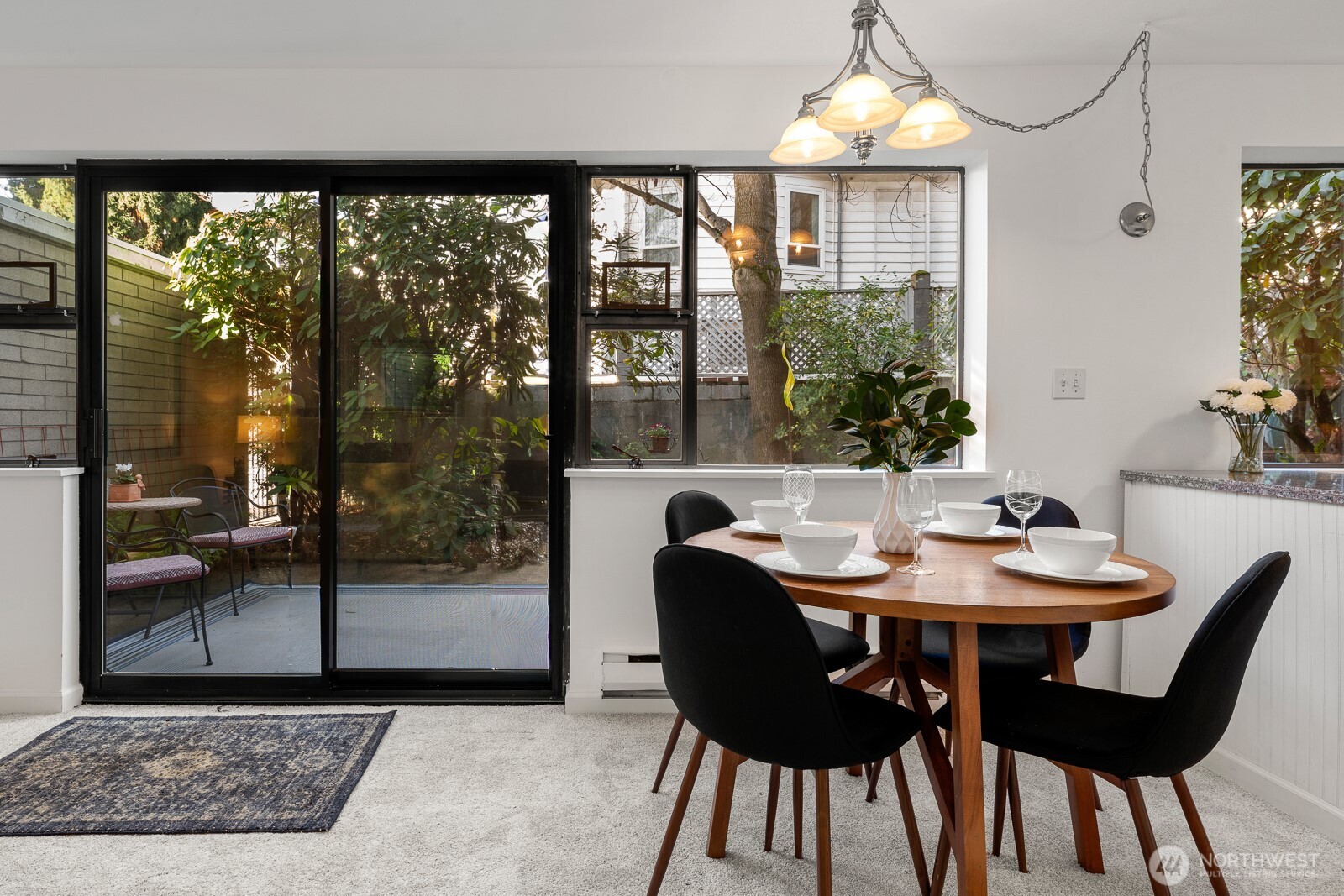 912 3rd Avenue West, Unit 101 Seattle, WA 98119 - Photo 5 of 25 a view of a dining room with furniture window and outside view