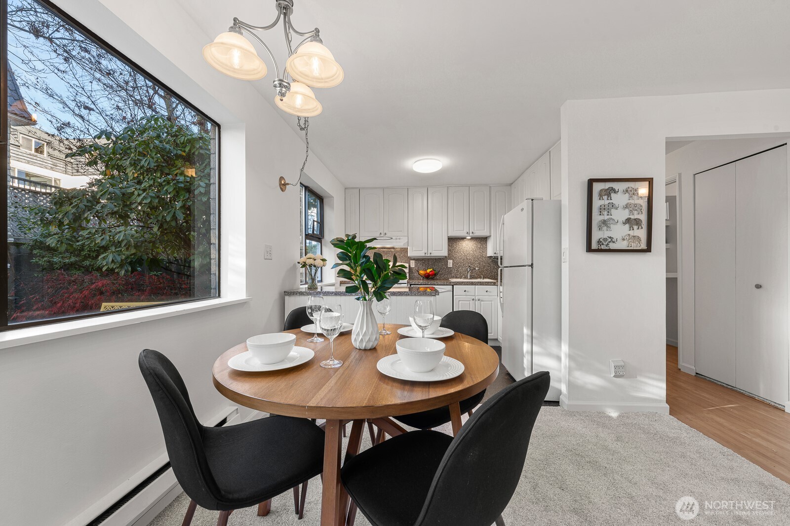 912 3rd Avenue West, Unit 101 Seattle, WA 98119 - Photo 6 of 25 a view of a dining room with furniture window and outside view