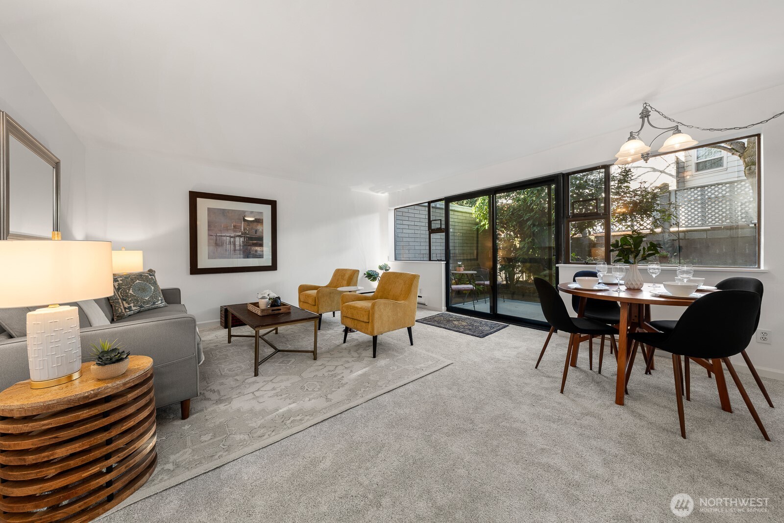 912 3rd Avenue West, Unit 101 Seattle, WA 98119 - Photo 7 of 25 a living room with furniture and a large window