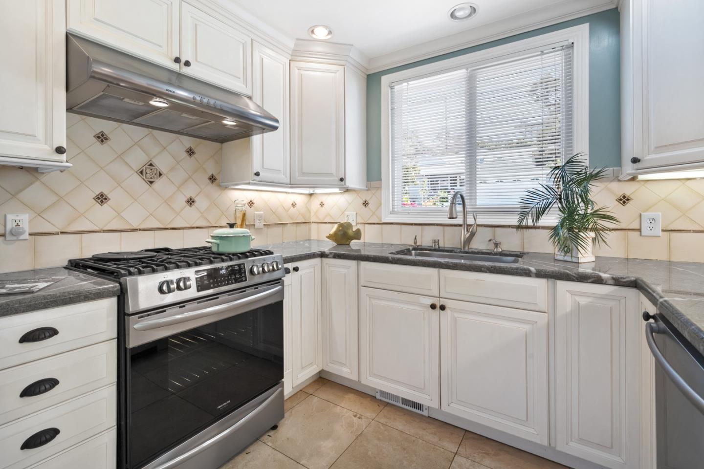 50 La Prenda Millbrae, CA 94030 - Photo 11 of 56 a kitchen with white cabinets and appliances