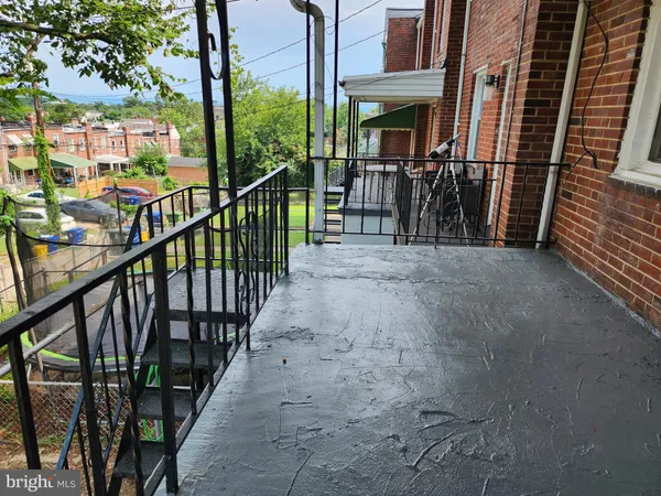 a view of a balcony with chairs