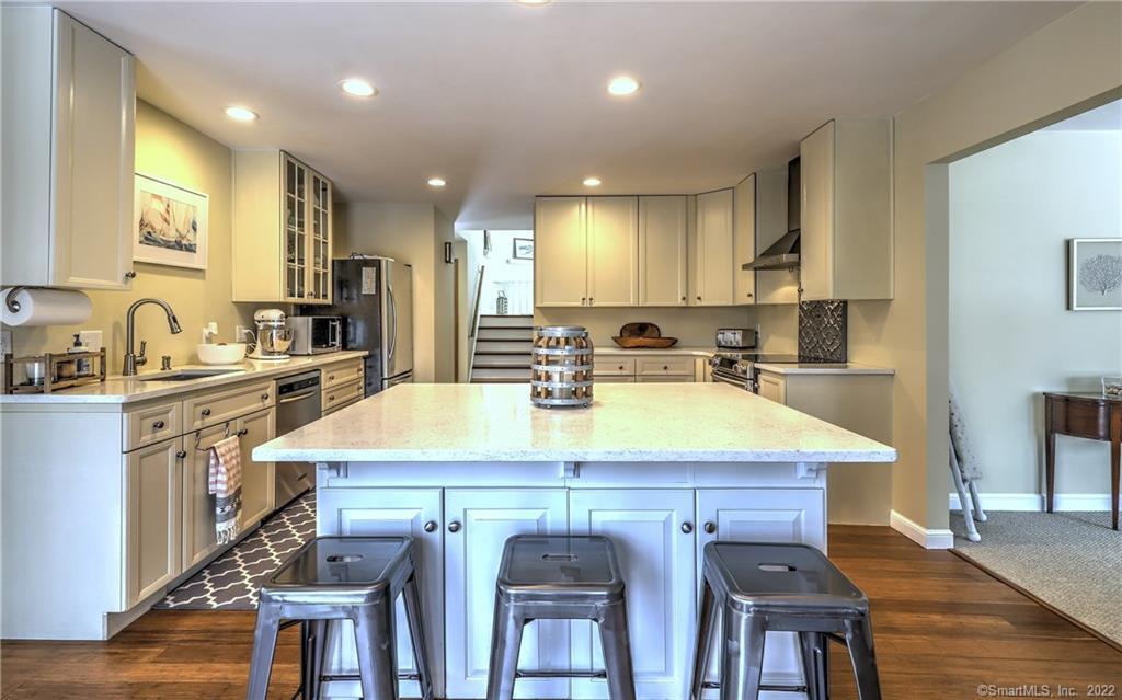 15 Coldspring Road Monroe, CT 06468 - Photo 1 of 1 a kitchen with kitchen island a sink table and chairs