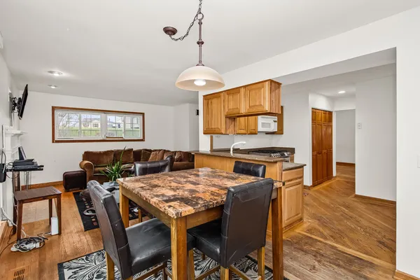 a view of a dining room with furniture window and wooden floor