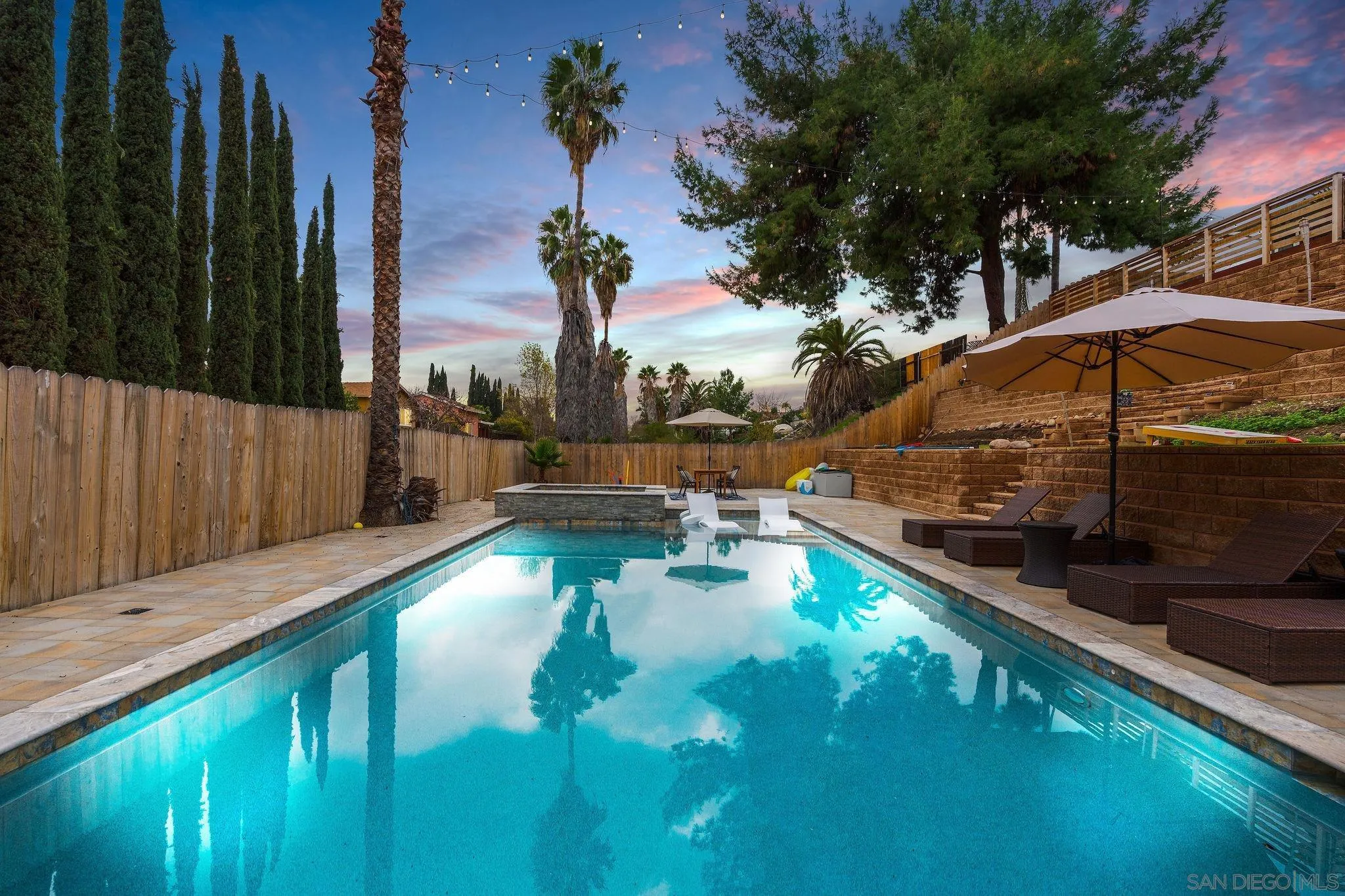 9735 Vomac Road Santee, CA 92071 - Photo 1 of 40 a view of a swimming pool with a patio