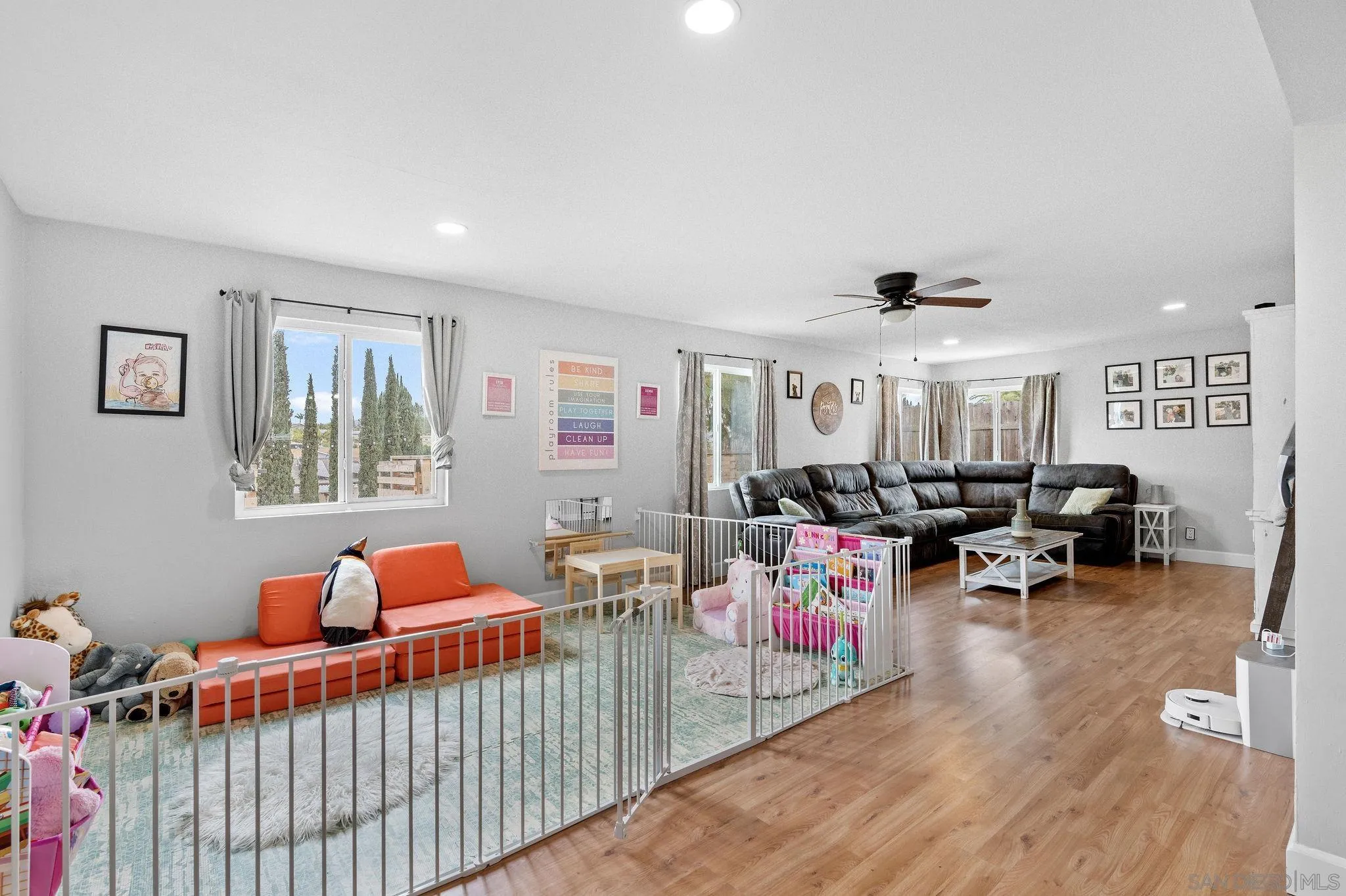 9735 Vomac Road Santee, CA 92071 - Photo 11 of 40 a living room with furniture and a wooden floor