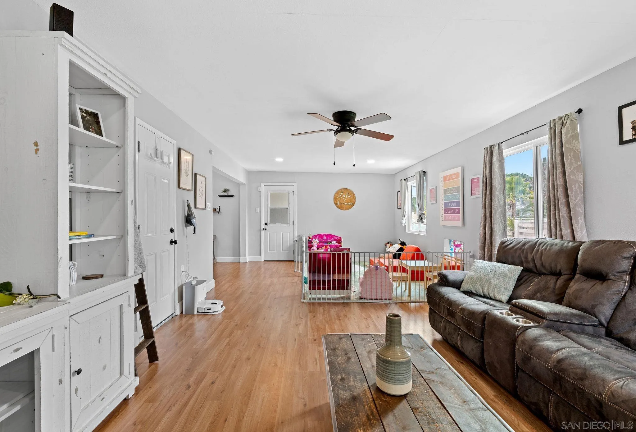 9735 Vomac Road Santee, CA 92071 - Photo 12 of 40 a living room with furniture and wooden floor