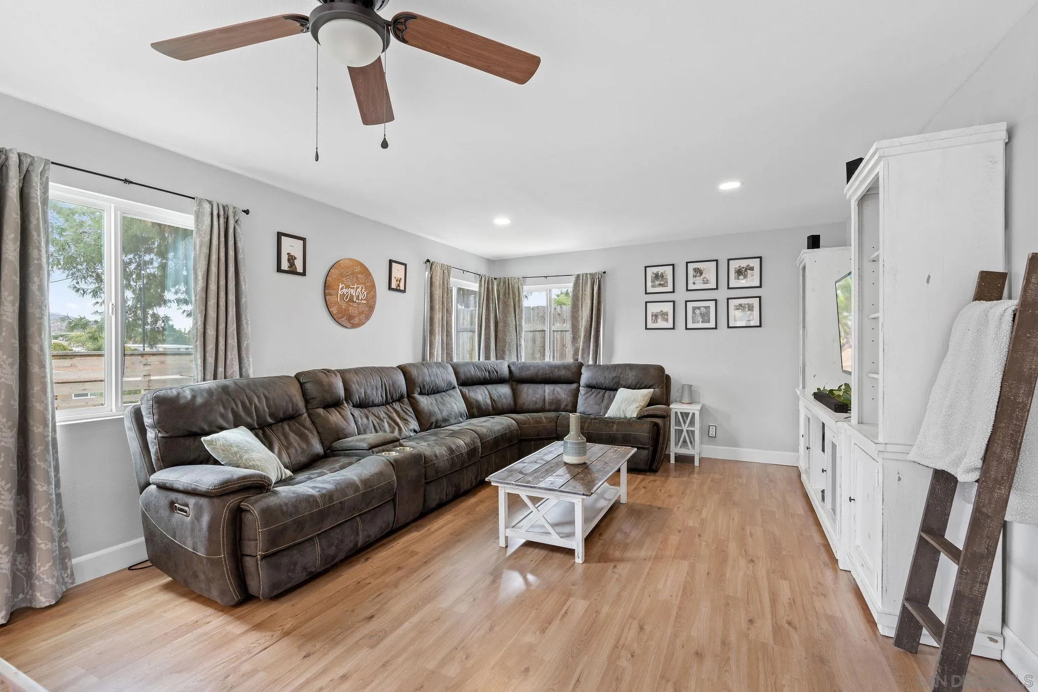9735 Vomac Road Santee, CA 92071 - Photo 13 of 40 a living room with furniture and wooden floor