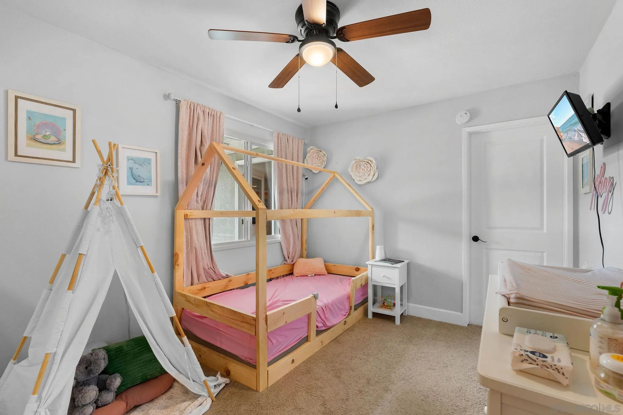 9735 Vomac Road Santee, CA 92071 - Photo 15 of 40 a bedroom with furniture and a window