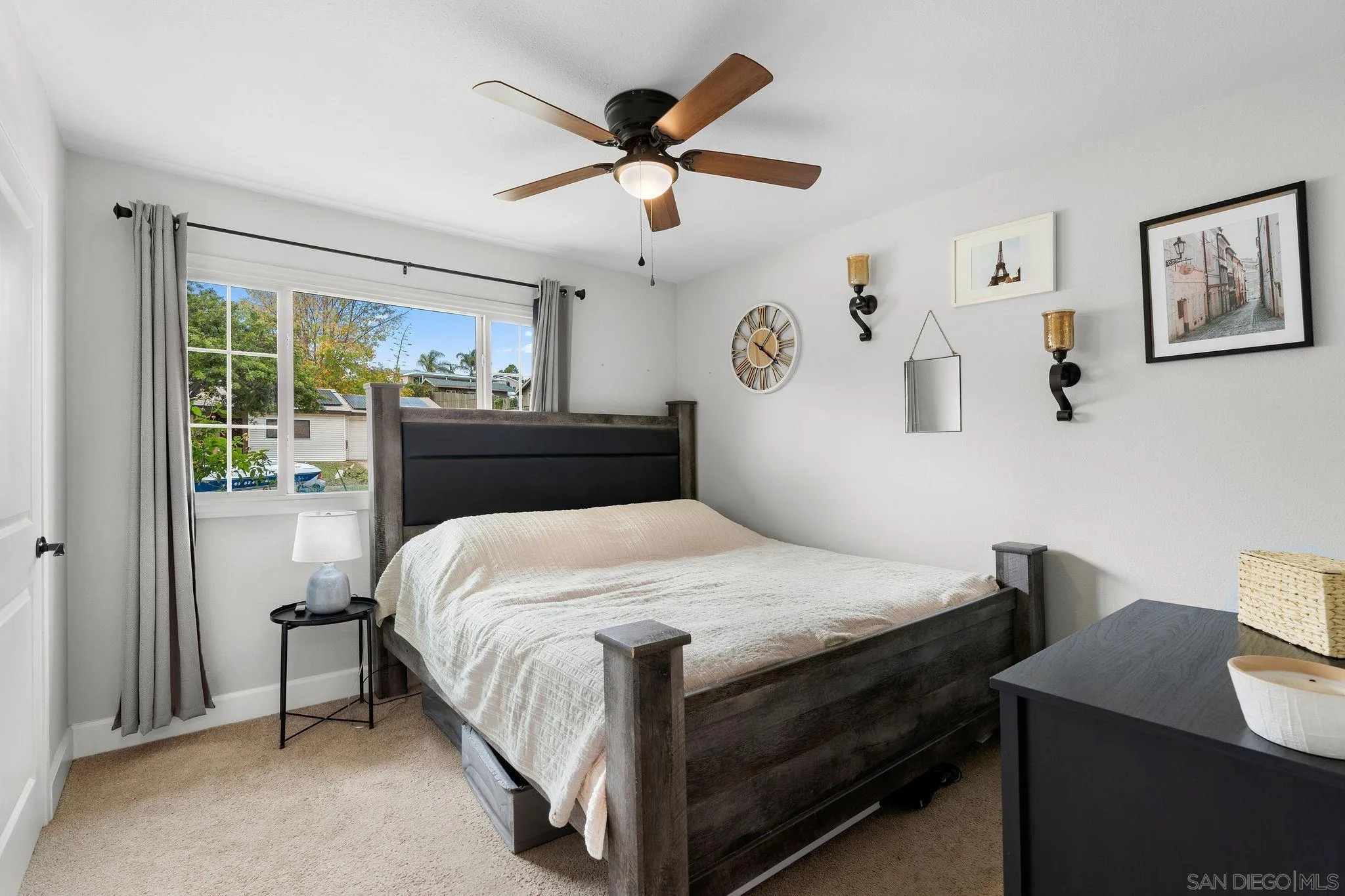 9735 Vomac Road Santee, CA 92071 - Photo 16 of 40 a bedroom with a bed and a desk