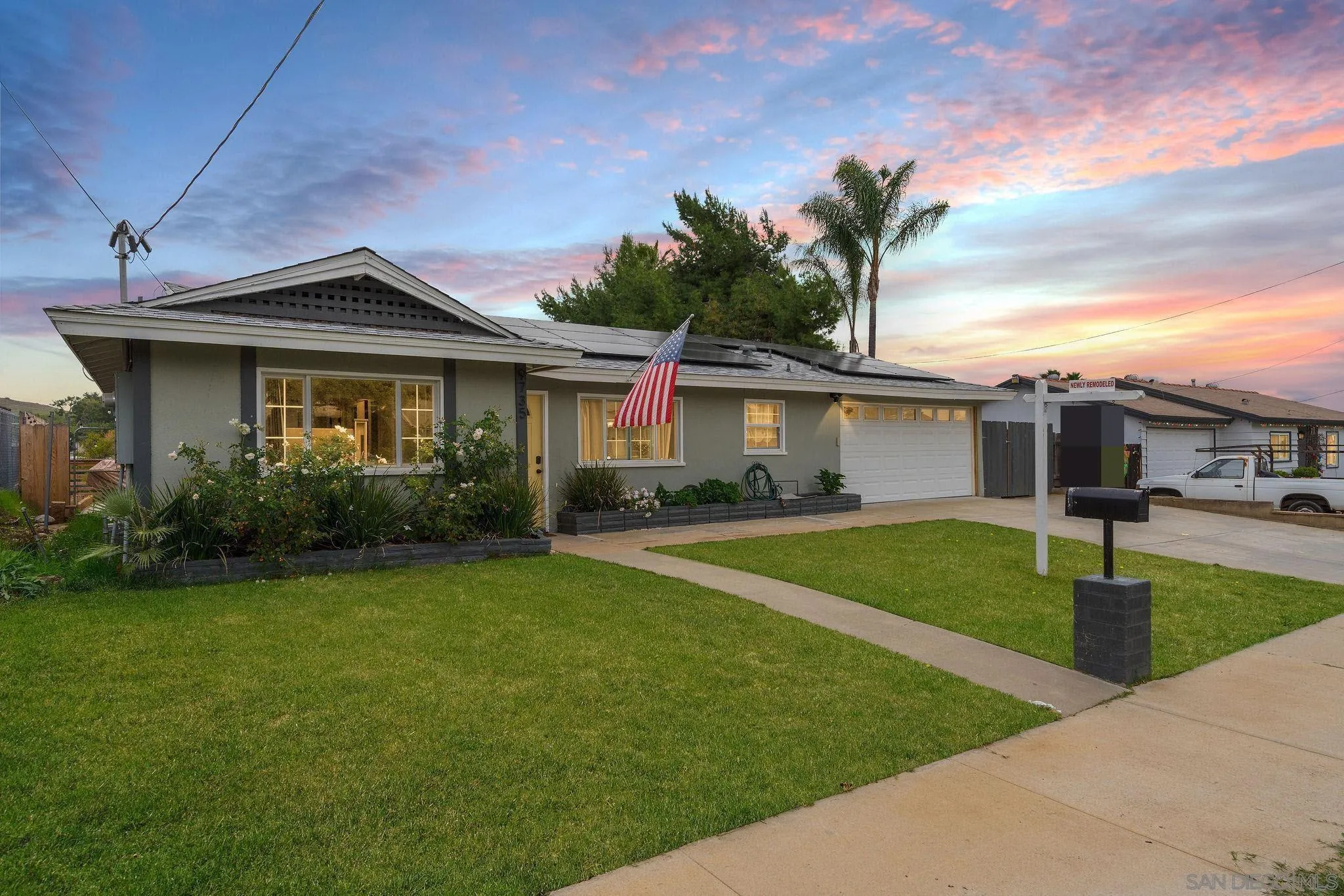 9735 Vomac Road Santee, CA 92071 - Photo 2 of 40 a front view of a house with garden