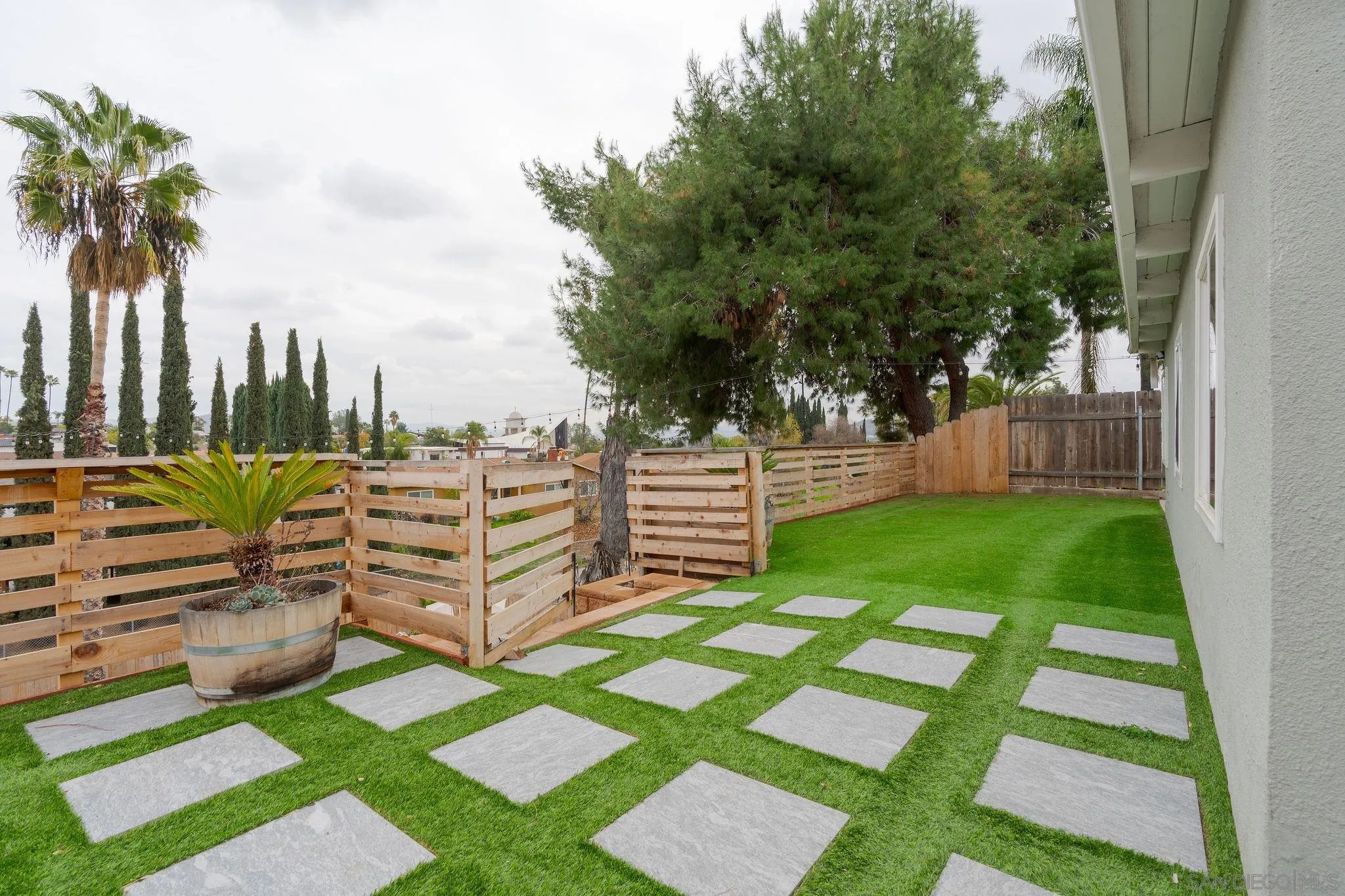 9735 Vomac Road Santee, CA 92071 - Photo 24 of 40 a view of a garden with wooden fence