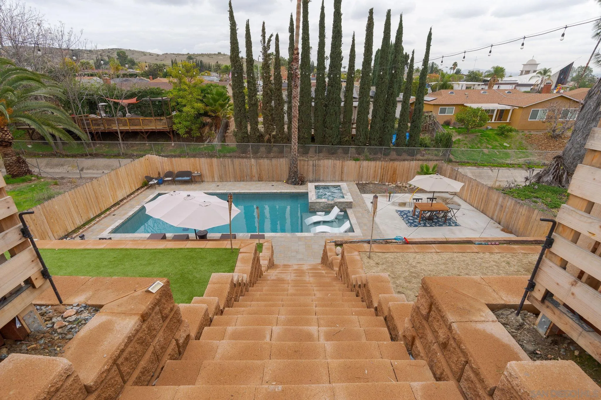 9735 Vomac Road Santee, CA 92071 - Photo 25 of 40 a view of swimming pool with a patio