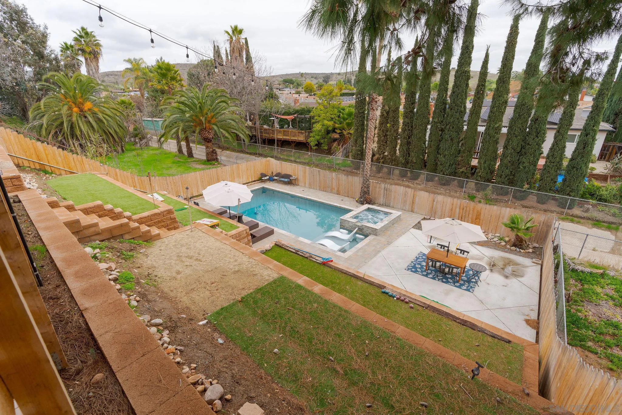 9735 Vomac Road Santee, CA 92071 - Photo 26 of 40 a view of swimming pool with a patio