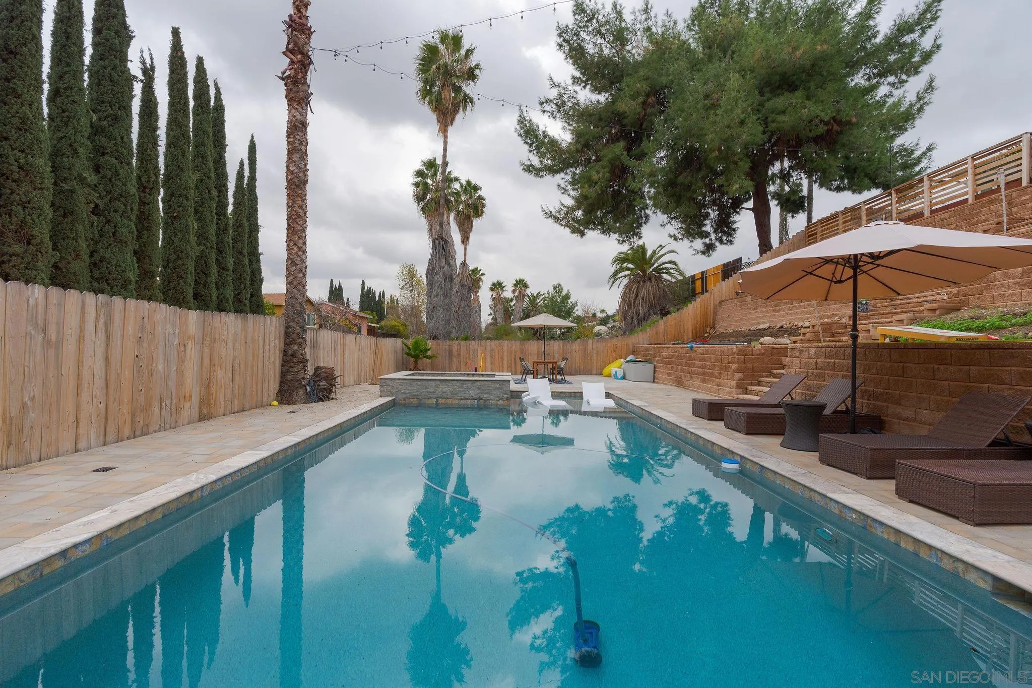9735 Vomac Road Santee, CA 92071 - Photo 32 of 40 a view of swimming pool with a patio