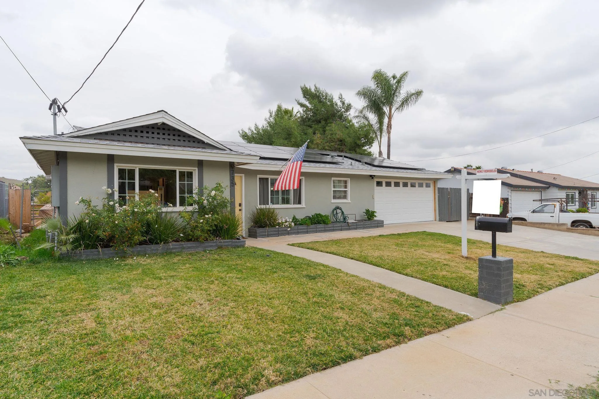9735 Vomac Road Santee, CA 92071 - Photo 36 of 40 a front view of a house with swimming pool