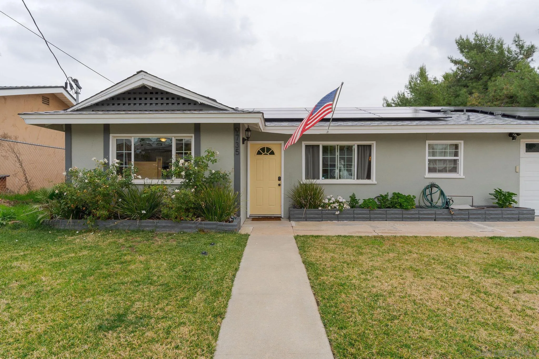 9735 Vomac Road Santee, CA 92071 - Photo 37 of 40 a front view of a house with garden
