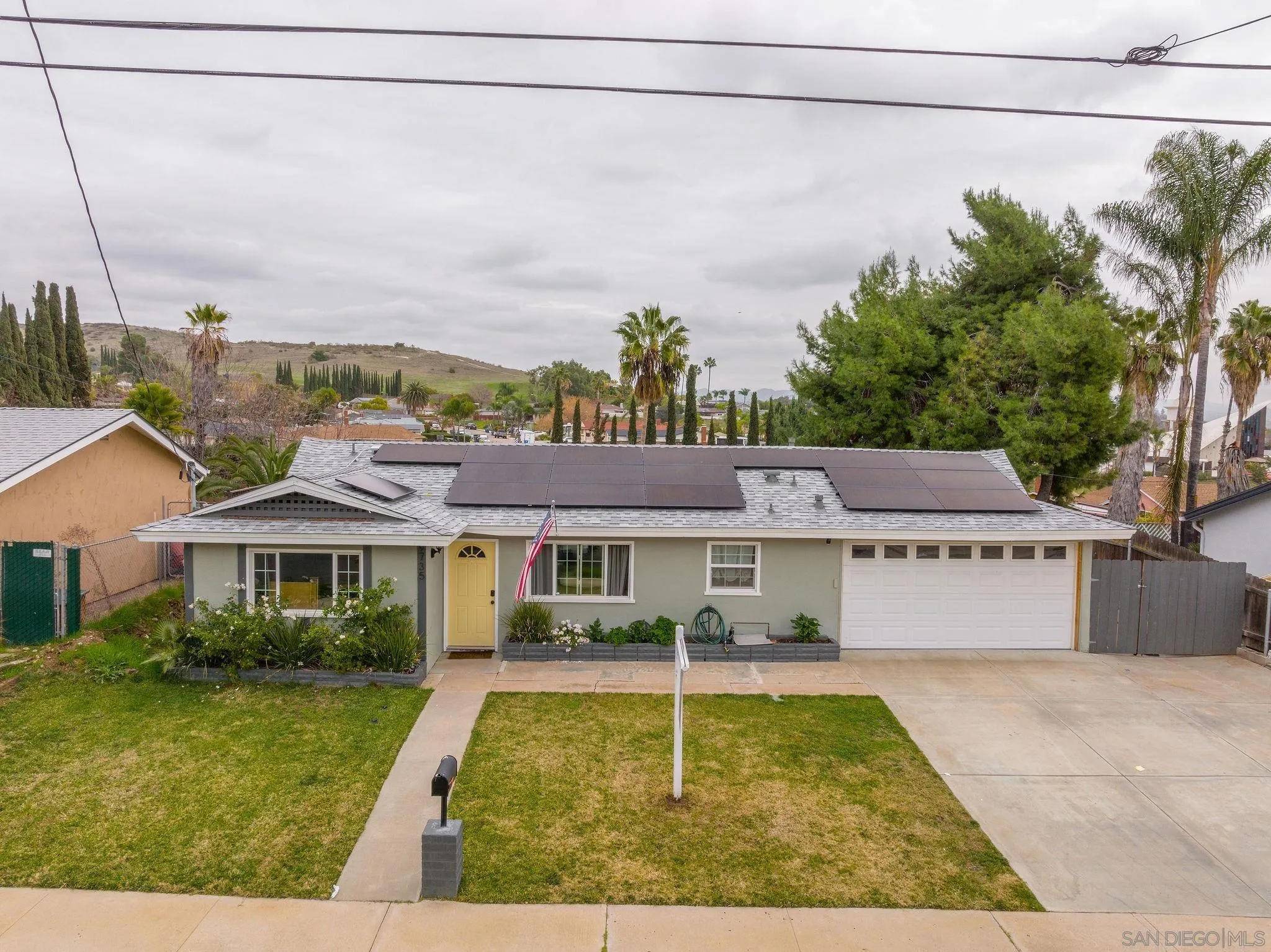 9735 Vomac Road Santee, CA 92071 - Photo 39 of 40 a front view of a house with garden