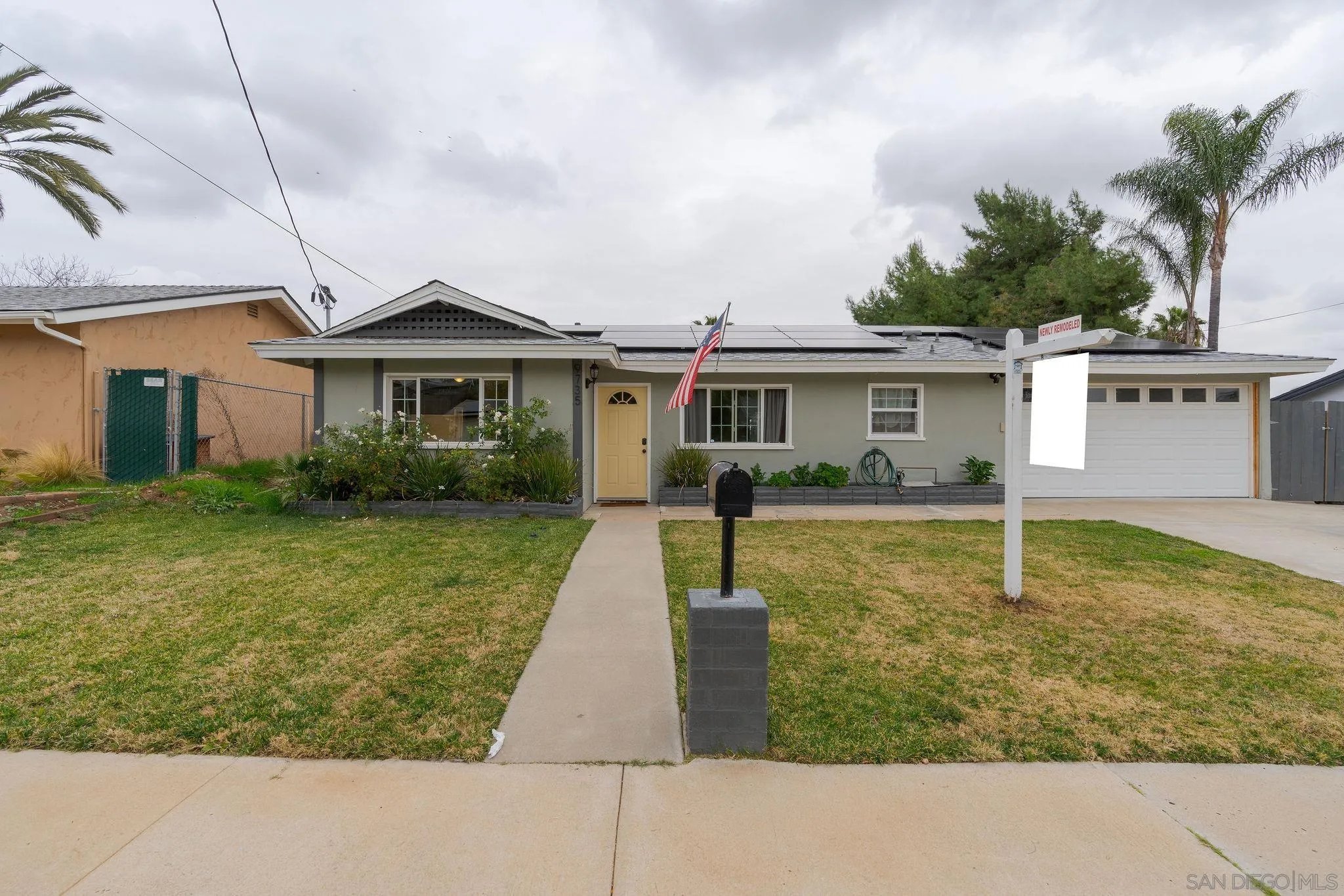9735 Vomac Road Santee, CA 92071 - Photo 40 of 40 a front view of a house with garden