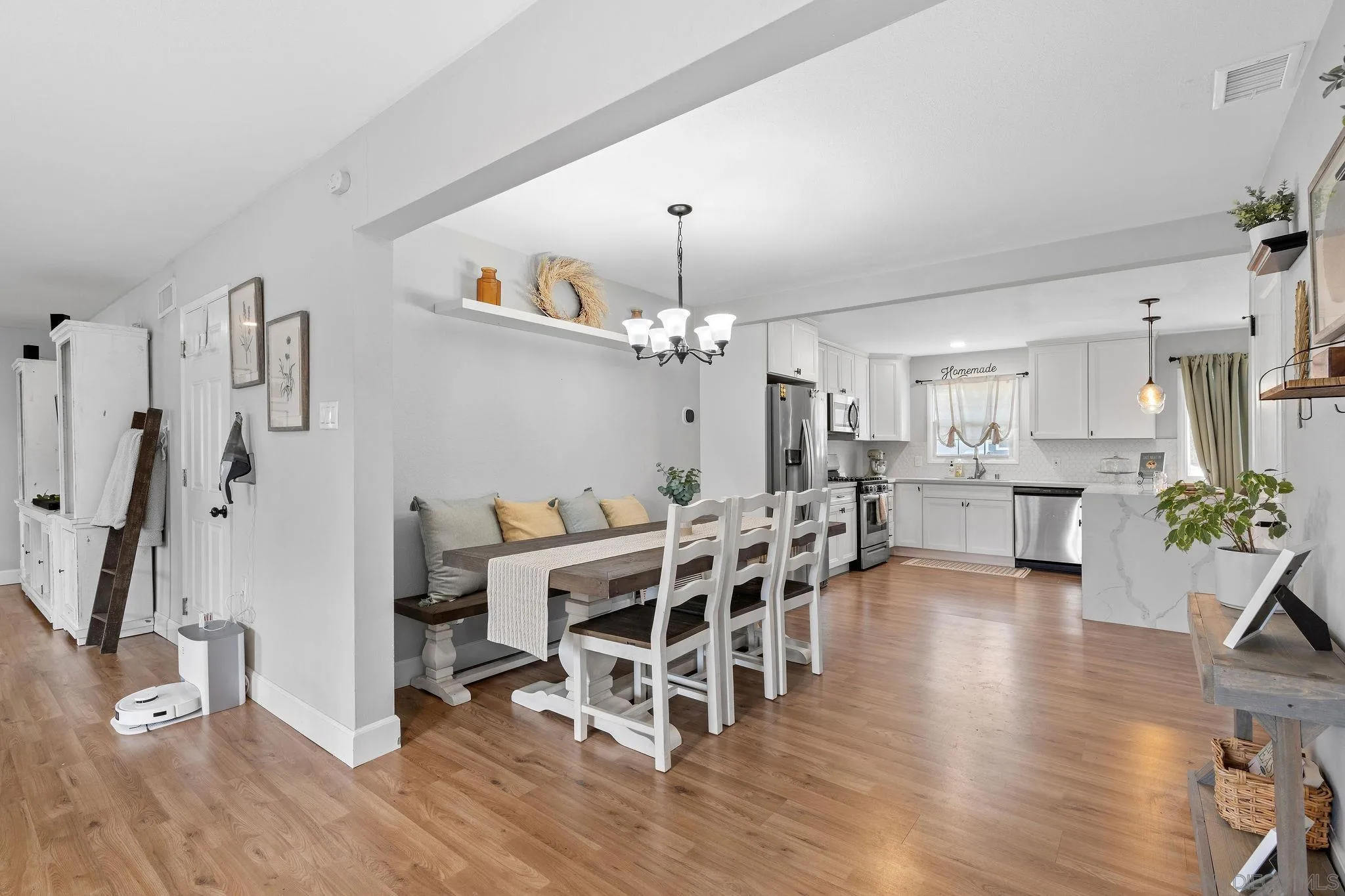 9735 Vomac Road Santee, CA 92071 - Photo 9 of 40 a view of a dining room with furniture and wooden floor